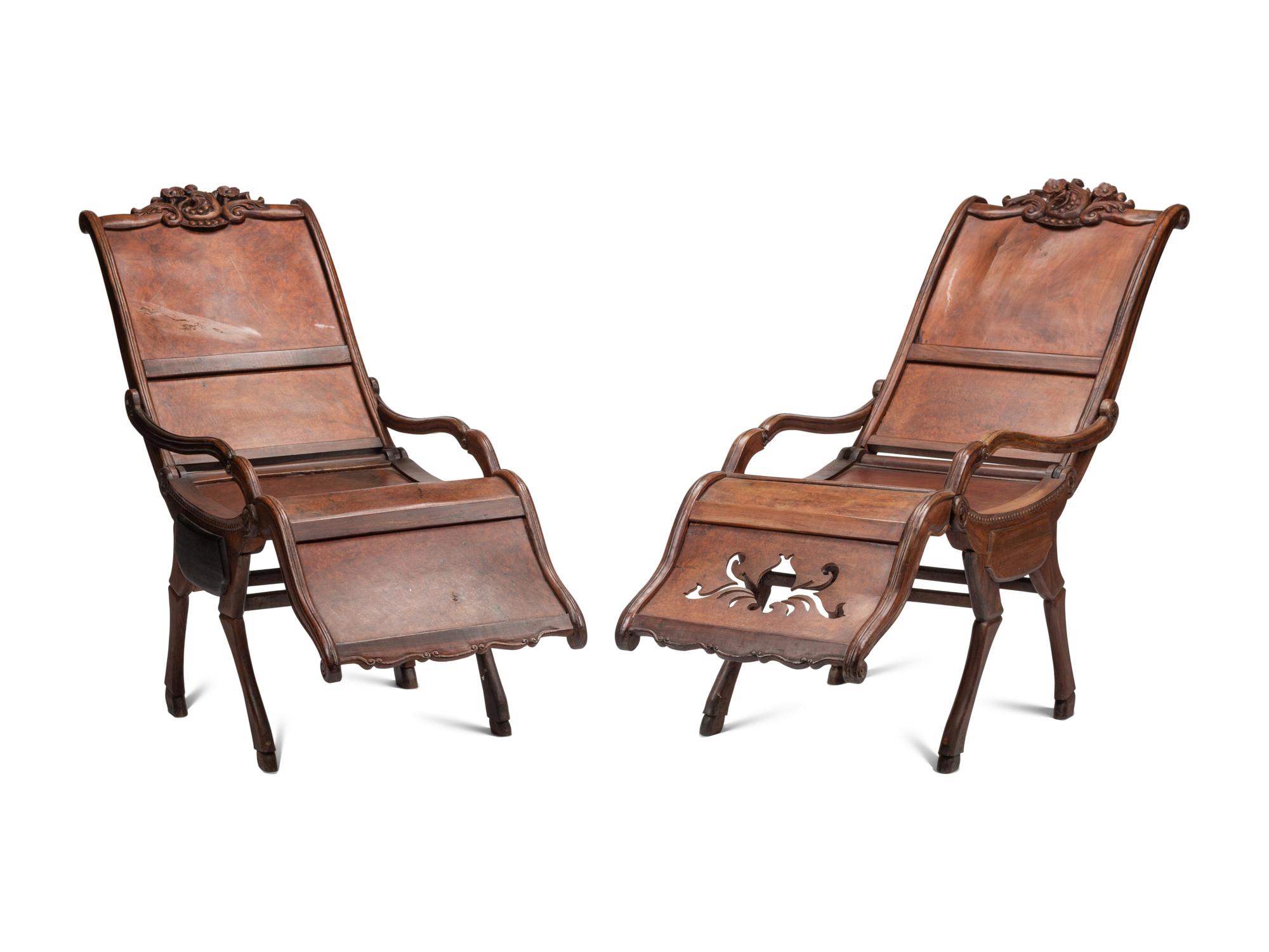 A Pair of Portuguese Colonial Carved Walnut Reclining Armchairs