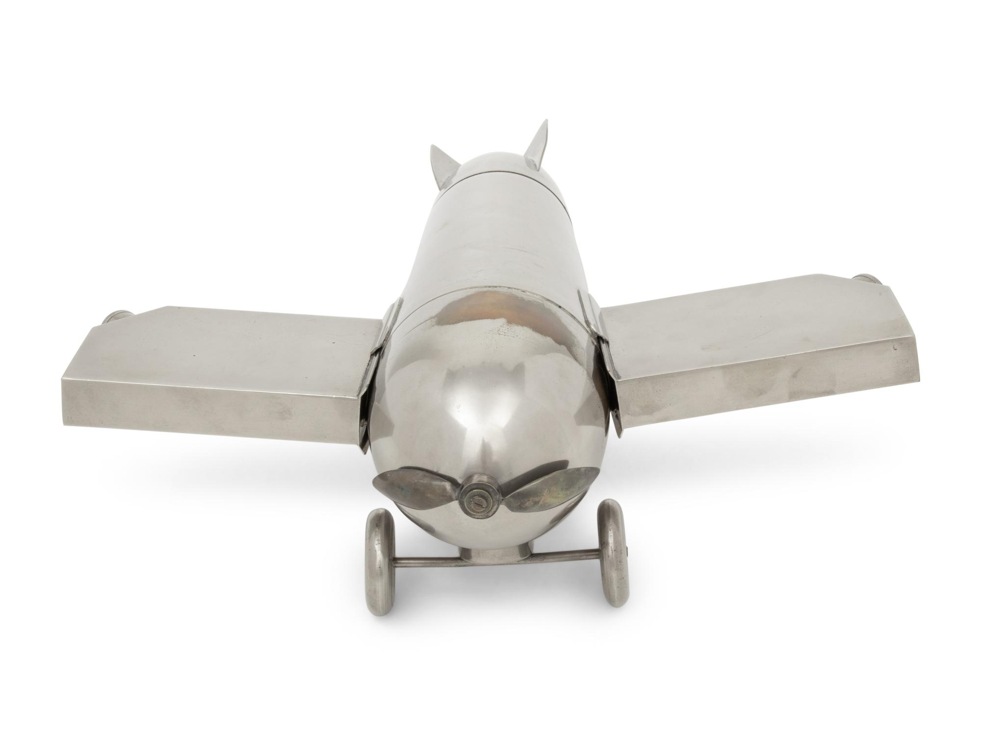 A German Chromed-Metal Airplane-Form Cocktail Shaker, Flask and Mixing Set