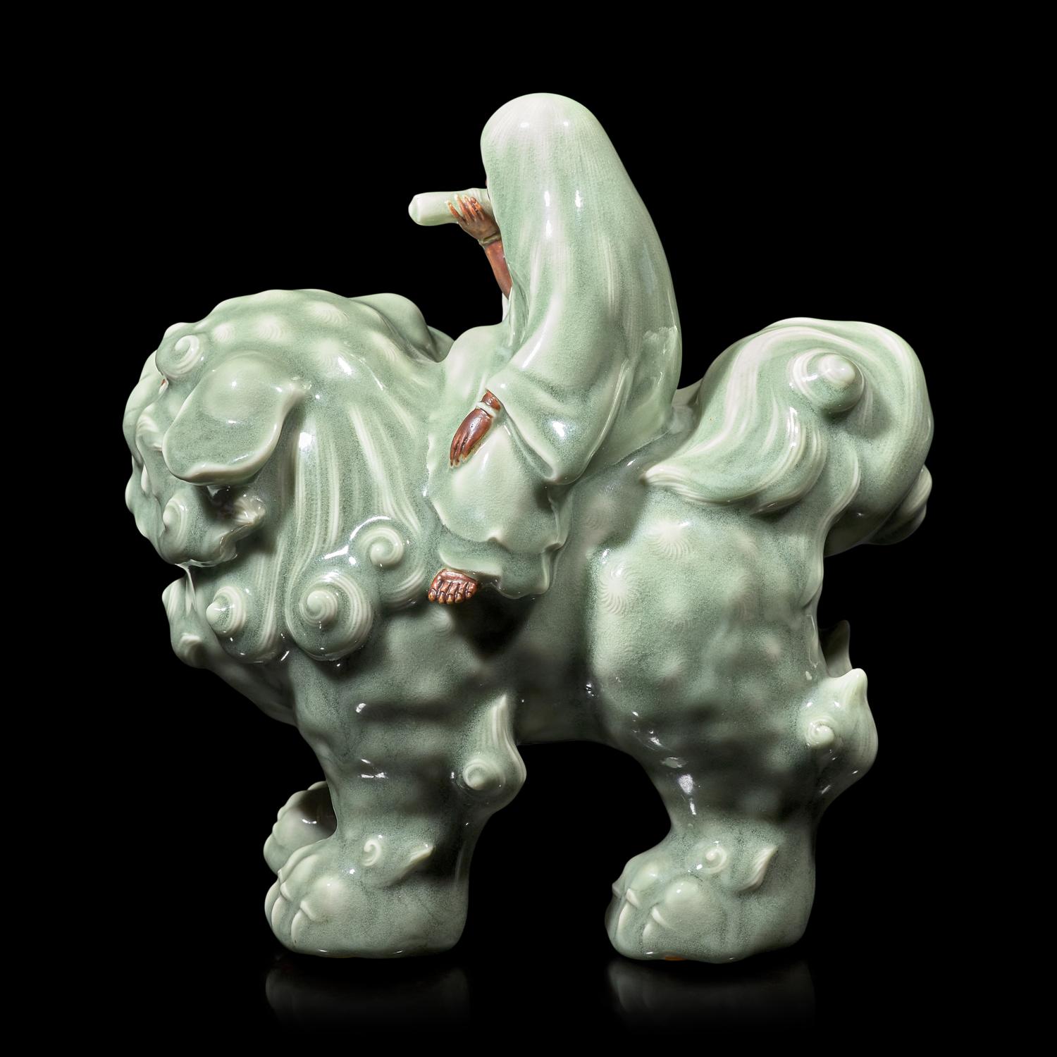 A Japanese Celadon-Glazed Monju on Lion, Impressed Seal Makuzu