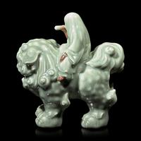 A Japanese Celadon-Glazed Monju on Lion, Impressed Seal Makuzu