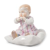 A Meissen Porcelain Figure of a Baby Feeding ,by Konrad Hentschel