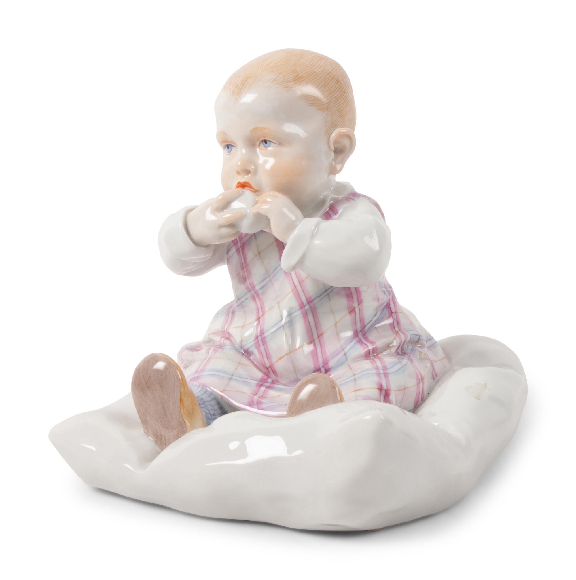 A Meissen Porcelain Figure of a Baby Feeding ,by Konrad Hentschel