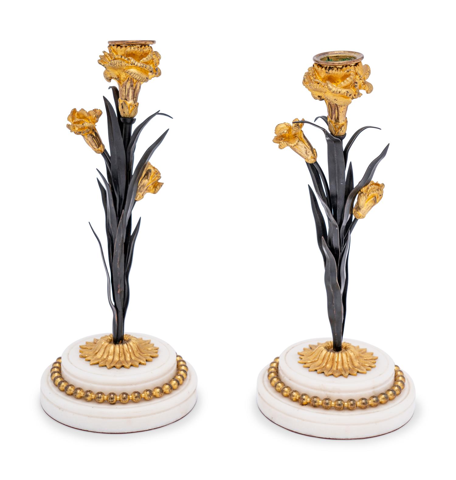 A Pair of French Tôle, Gilt Metal and Marble Candlesticks