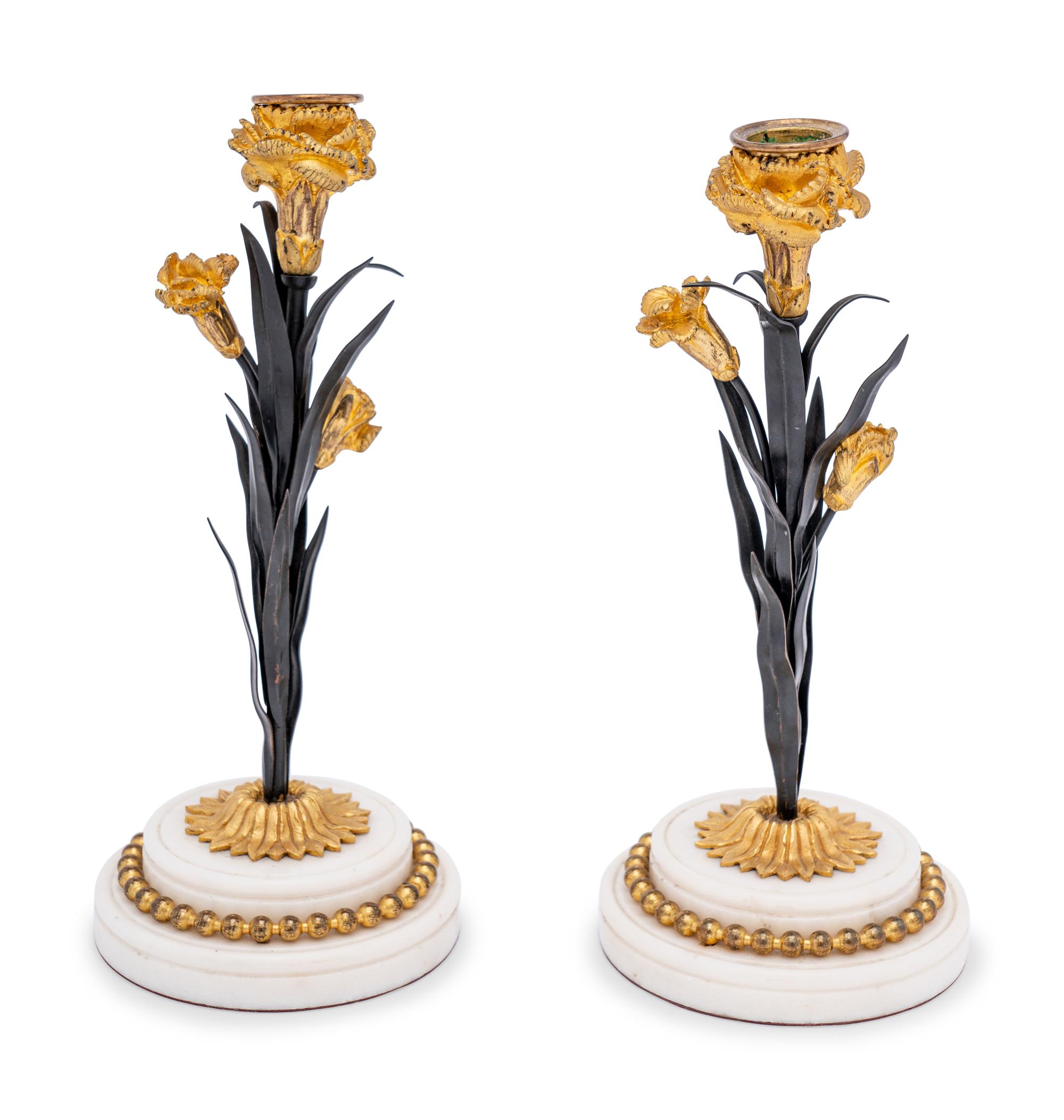 A Pair of French Tôle, Gilt Metal and Marble Candlesticks
