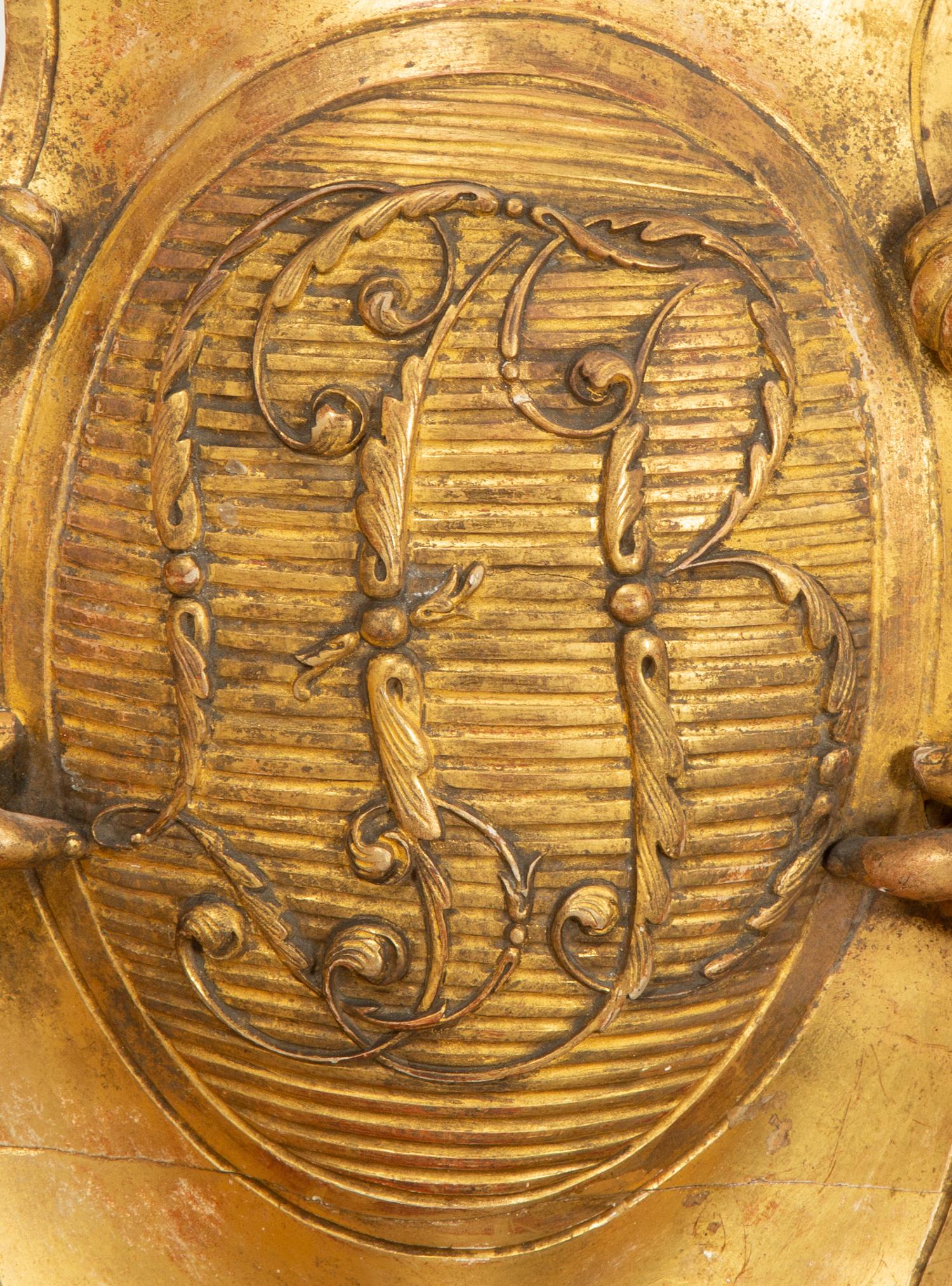 A Continental Carved Giltwood Cherub Wall Plaque