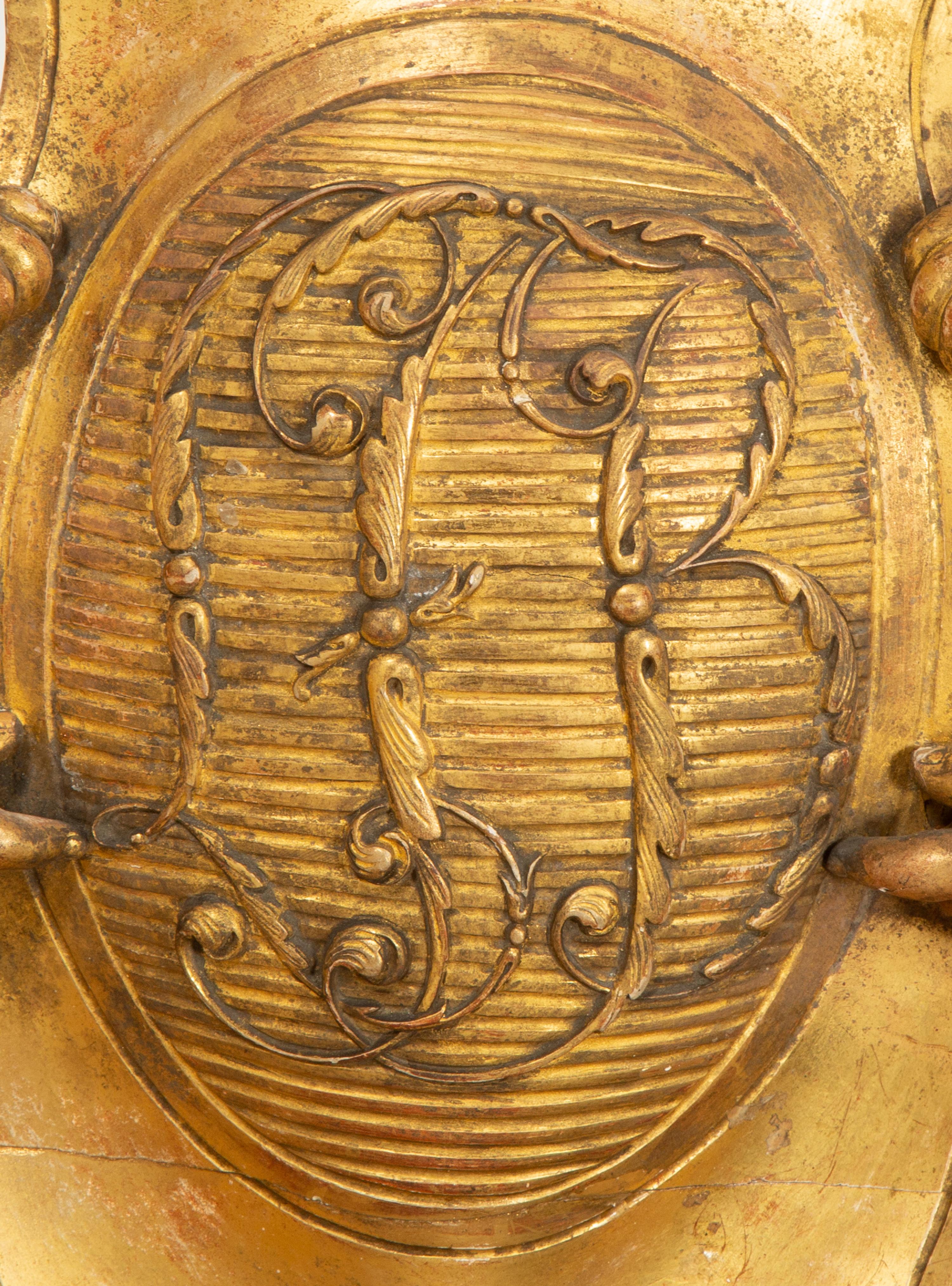 A Continental Carved Giltwood Cherub Wall Plaque