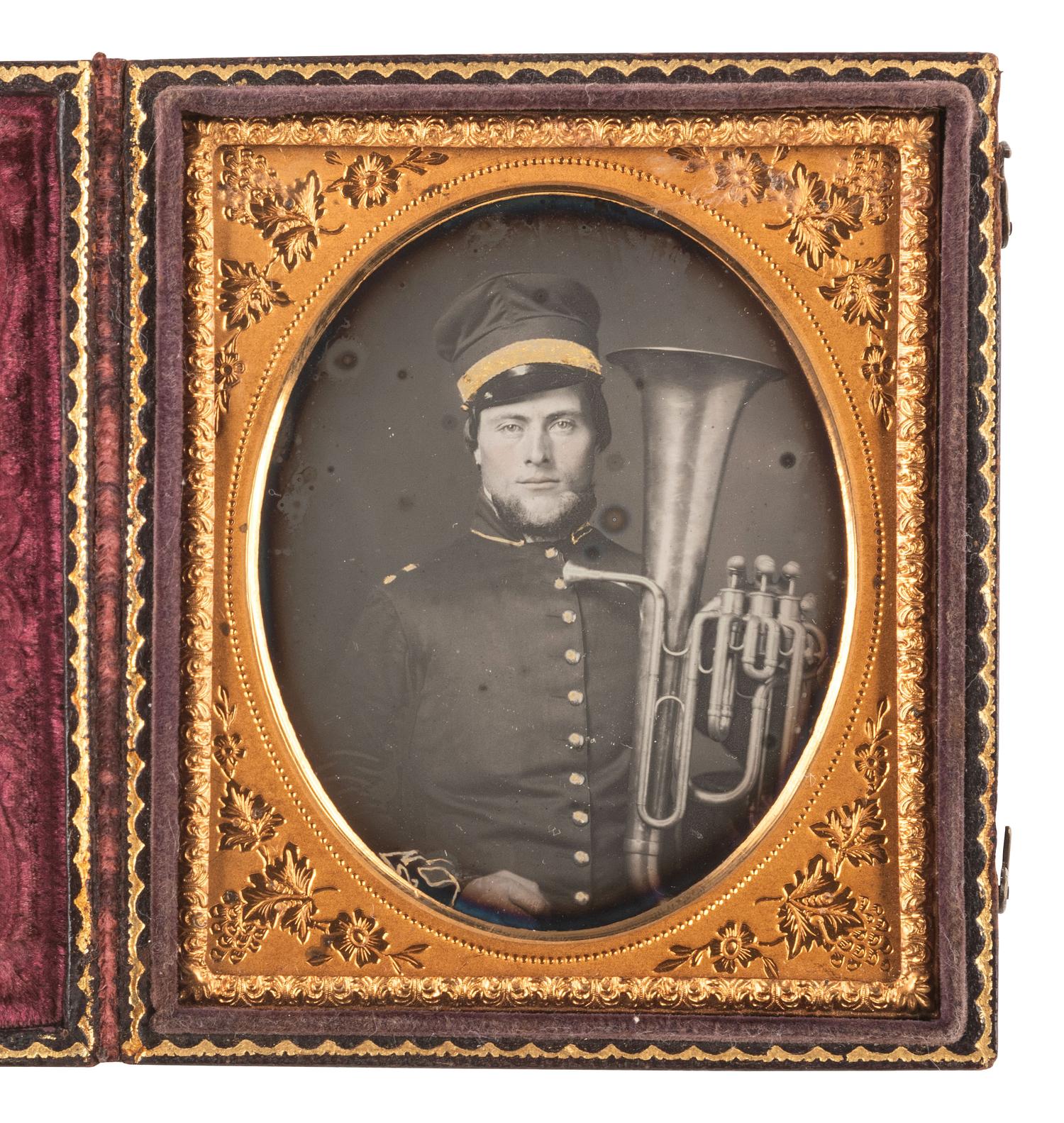 [EARLY PHOTOGRAPHY]. Sixth plate daguerreotype of uniformed bandsman holding a baritone saxhorn.