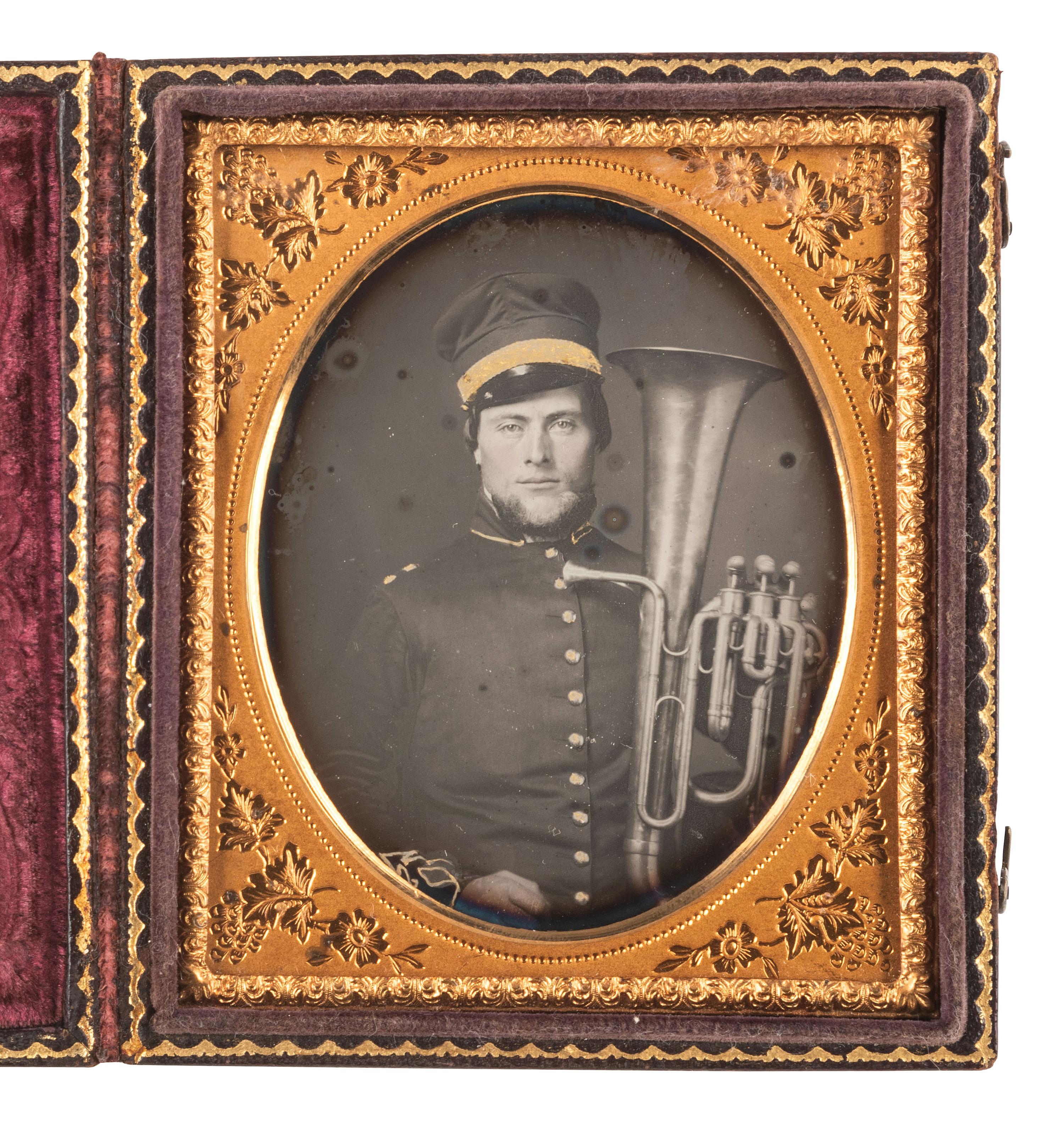 [EARLY PHOTOGRAPHY]. Sixth plate daguerreotype of uniformed bandsman holding a baritone saxhorn.