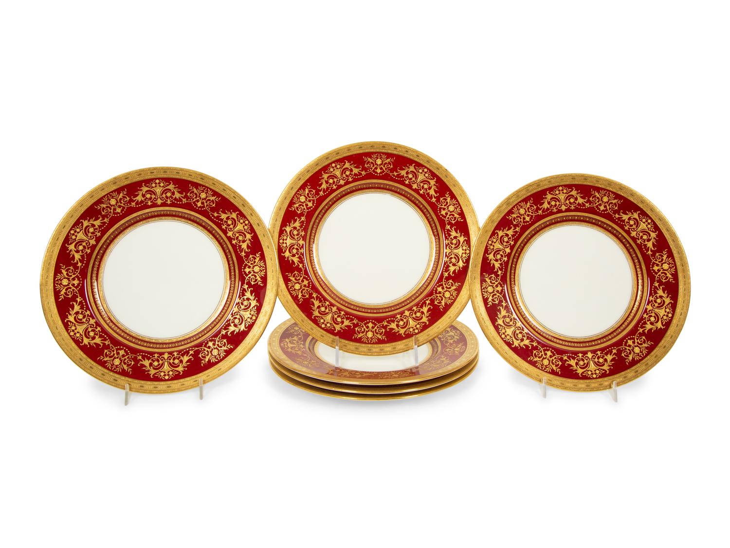 A Set of Twelve Mintons Gilt-Decorated Ruby-Ground Porcelain Dinner Plates