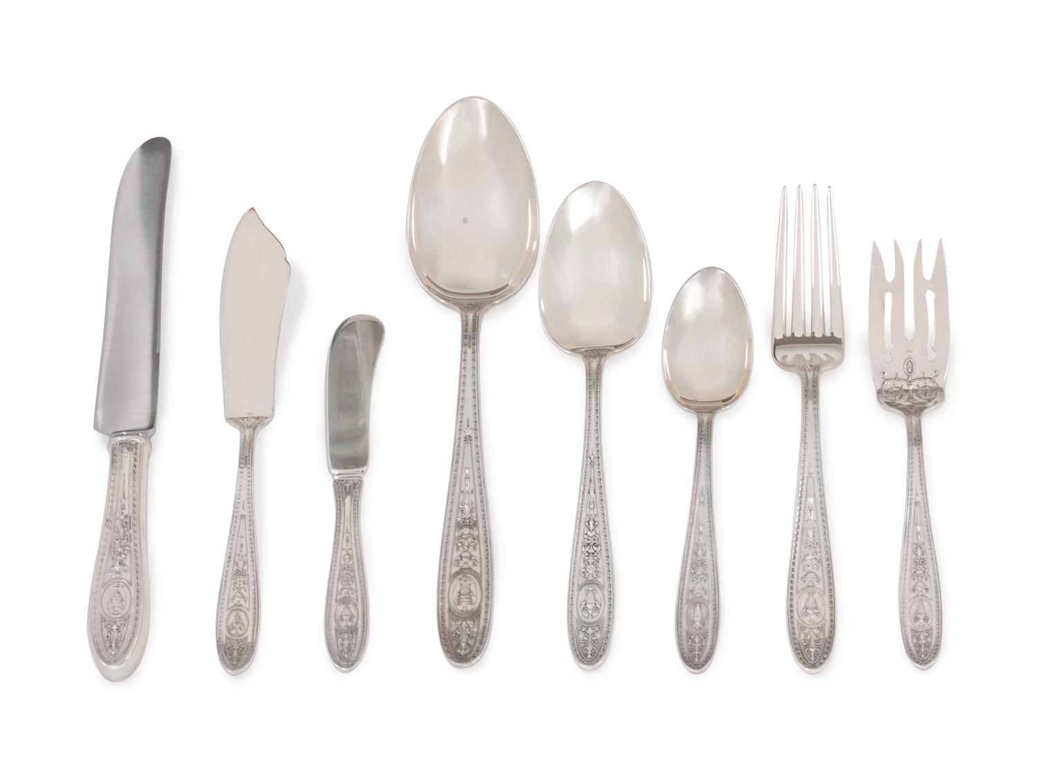 Wedgwood pattern, comprising 8 dinner knives with stainless steel blades 8 dinner forks 8 salad forks 16 teaspoons 8 butter spreaders 1 butter serving knife 8 tablespoons 2 serving spoons 59 items total.