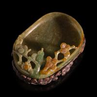 A Chinese Carved Jadeite "Pine and Spider" Brush Washer and Carved Wood Stand, Qing Dynasty — 清 翡翠鏤雕松紋洗