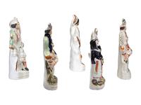 Four Staffordshire Glazed Figures and a Figural Watch Hutch