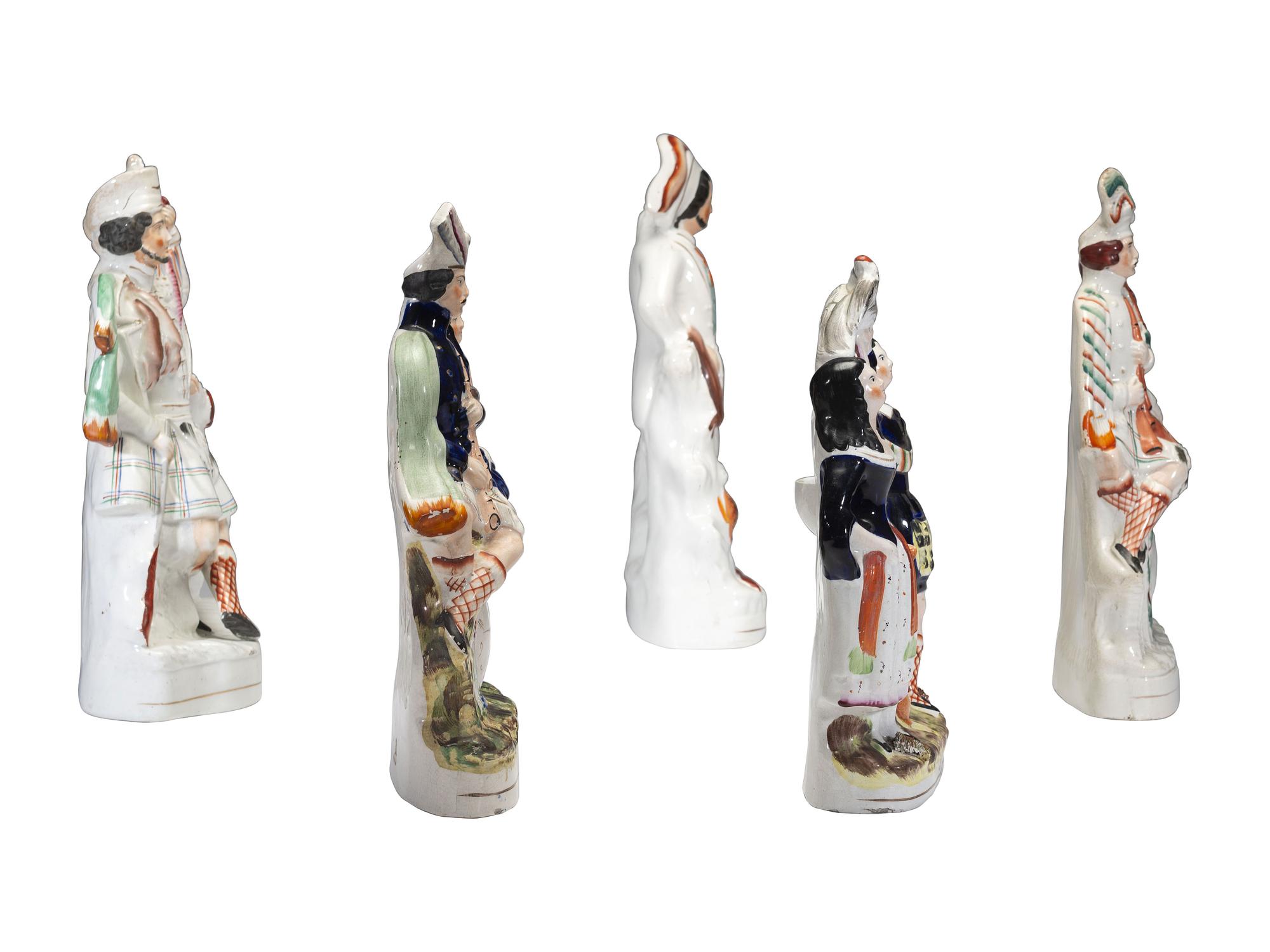 Four Staffordshire Glazed Figures and a Figural Watch Hutch