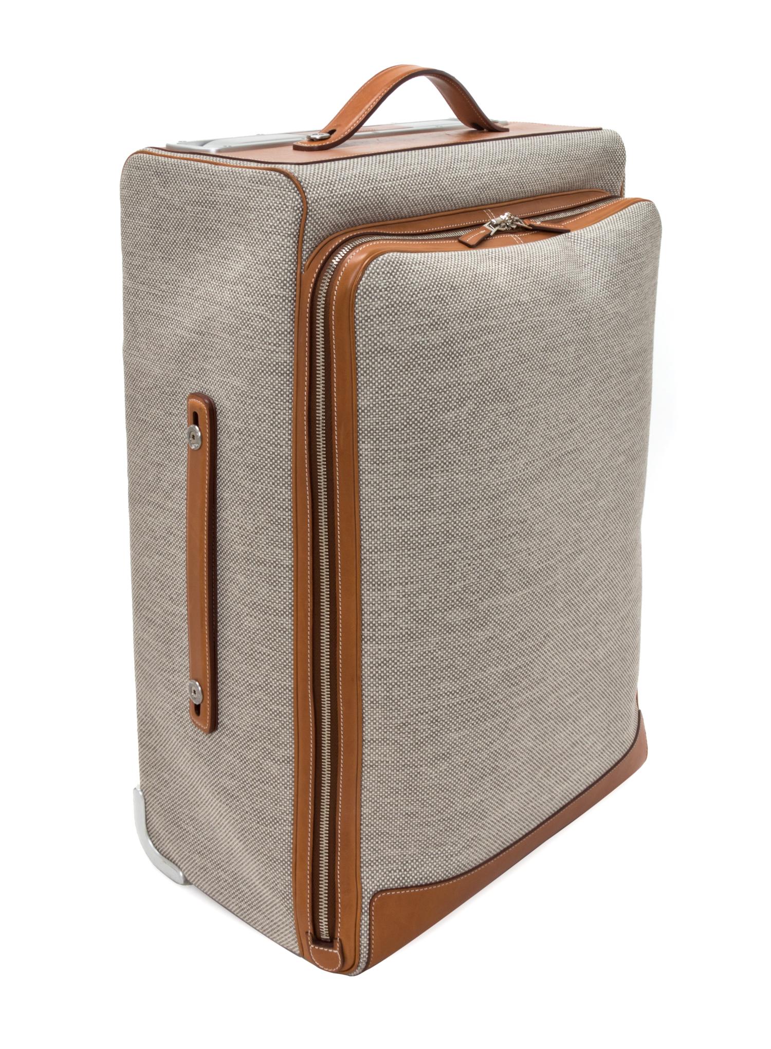 An Hermes Ecru Canvas and Fawn Barenia Calfskin Caleche-Express Suitcase, 14" x 21.5" x 10".
