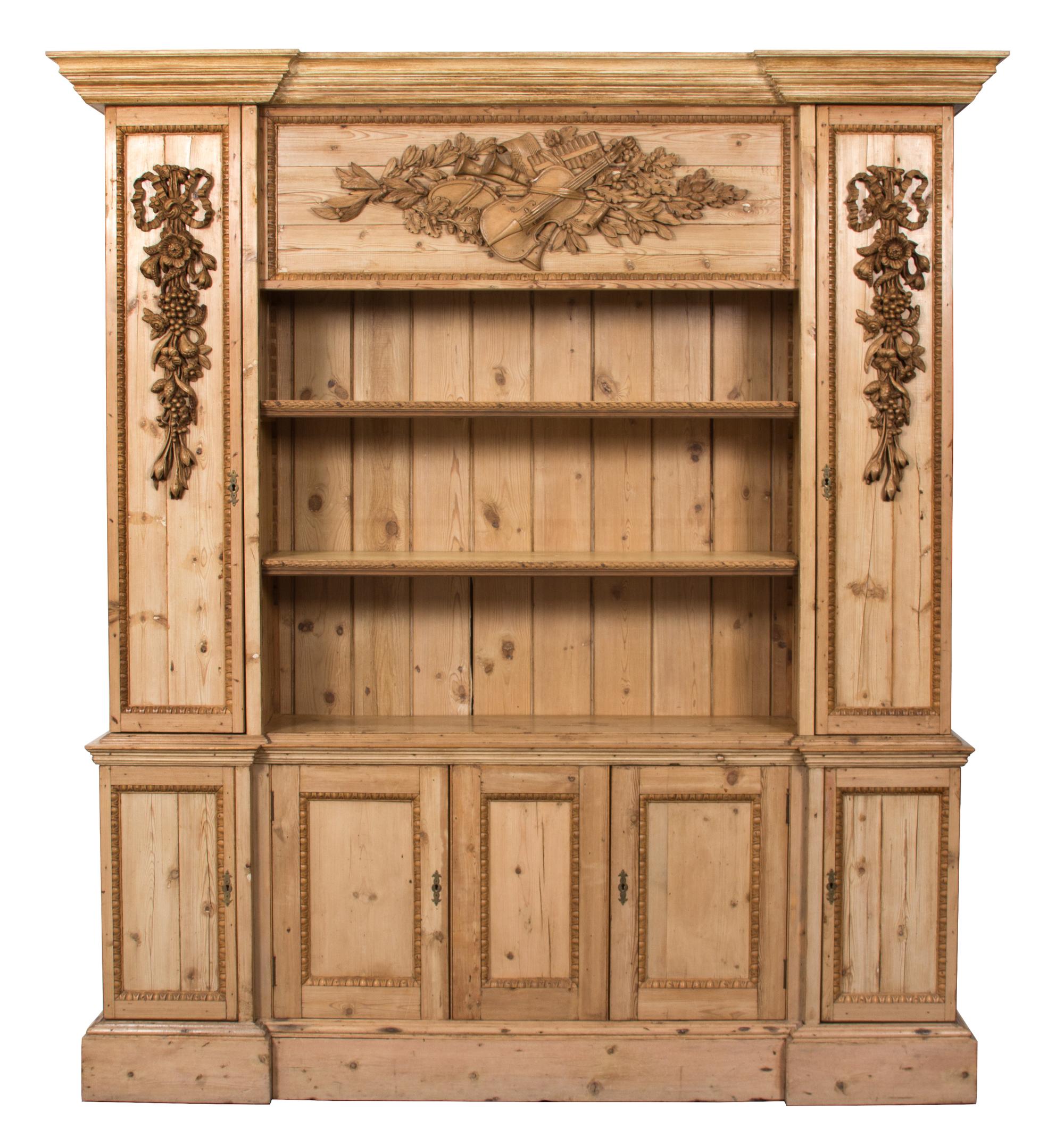 A Georgian Style Carved Pine Breakfront Height 91 x width 77 x depth 17 1/2 inches. — 20TH CENTURY