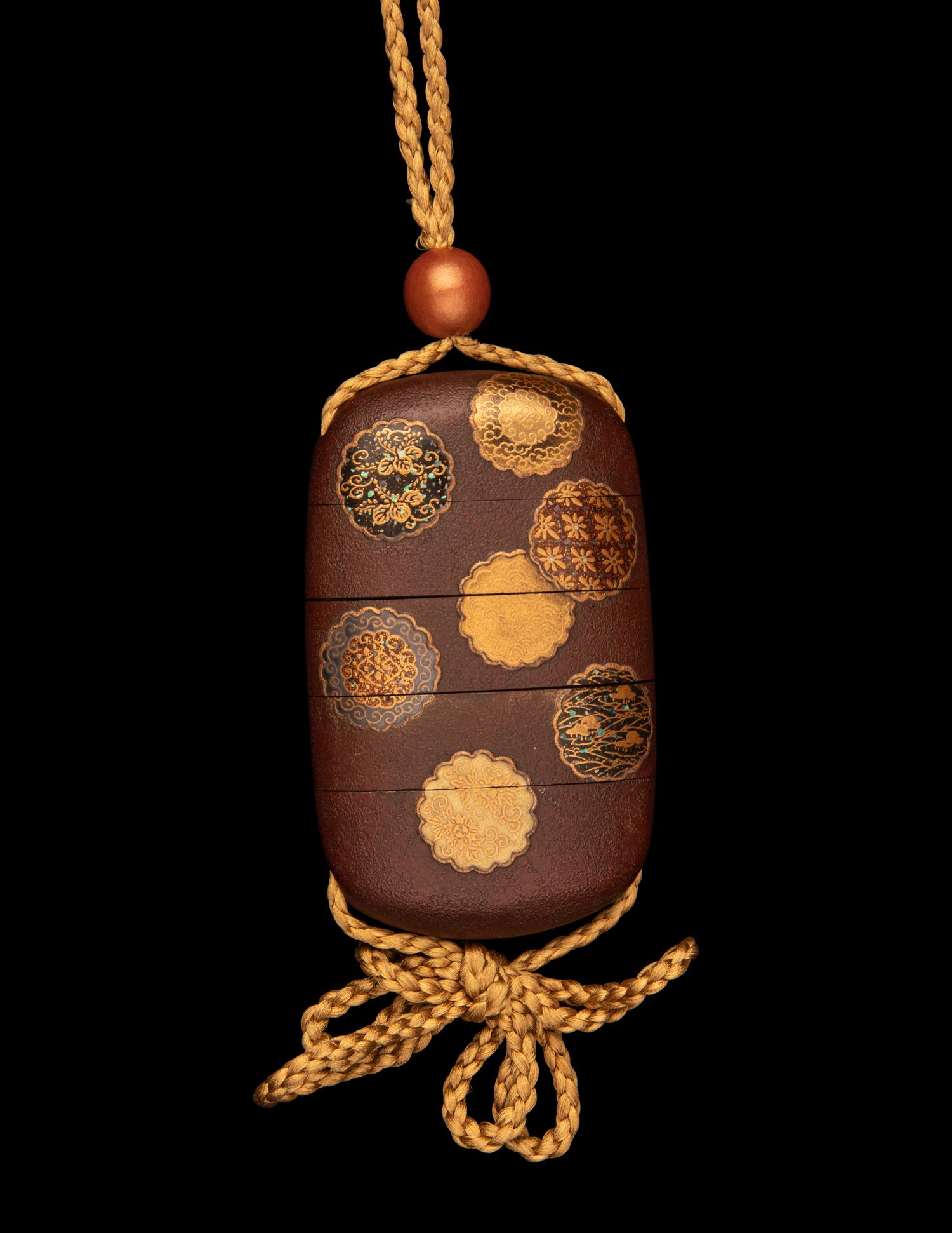 A Japanese Simulated Leather and Lacquered Four-Case Inro