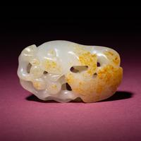 A Chinese Russet and White Jade 'Squirrel and Grape' Carving, 18th/19th Century — 清中期 白玉留皮松鼠葡萄