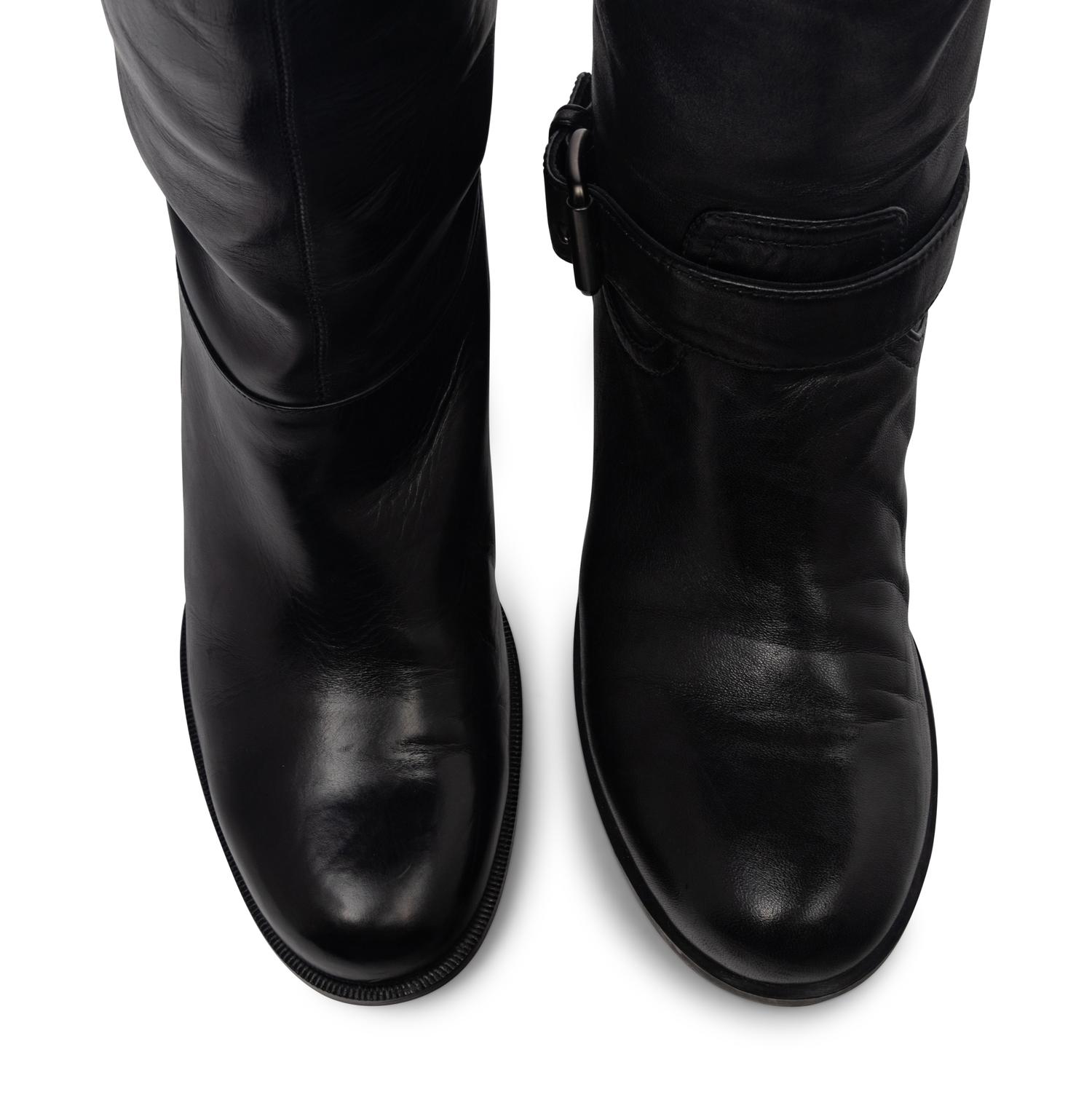 Two Pairs of Boots by Christian Louboutin and Prada Sport