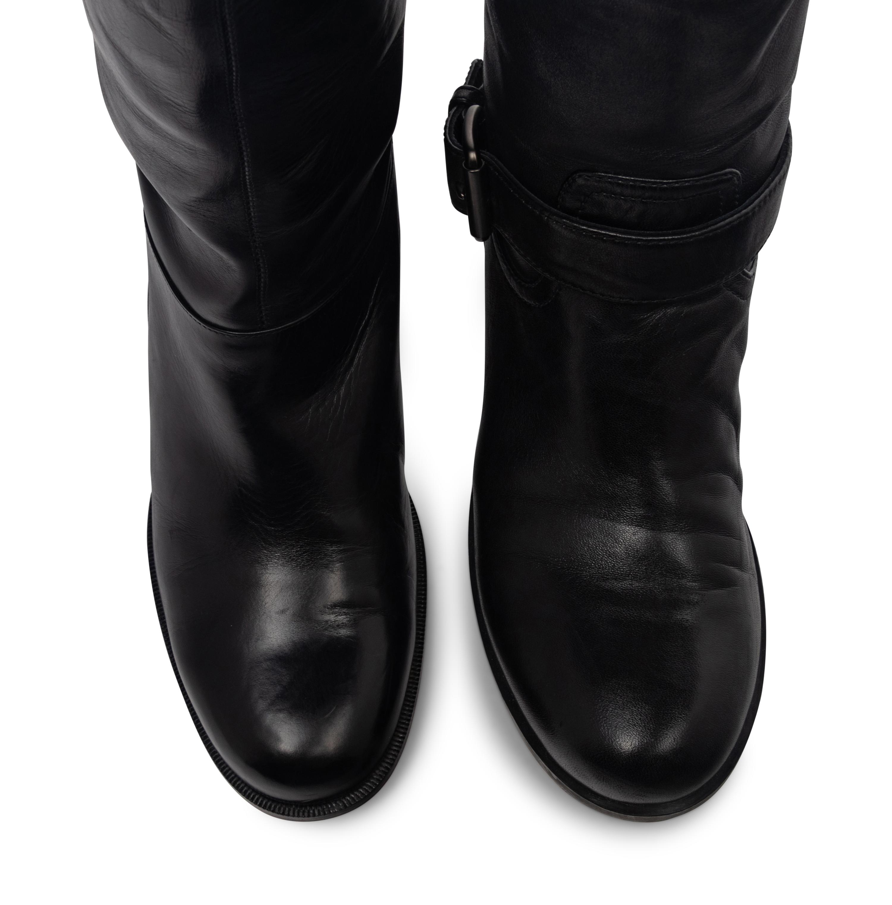 Two Pairs of Boots by Christian Louboutin and Prada Sport