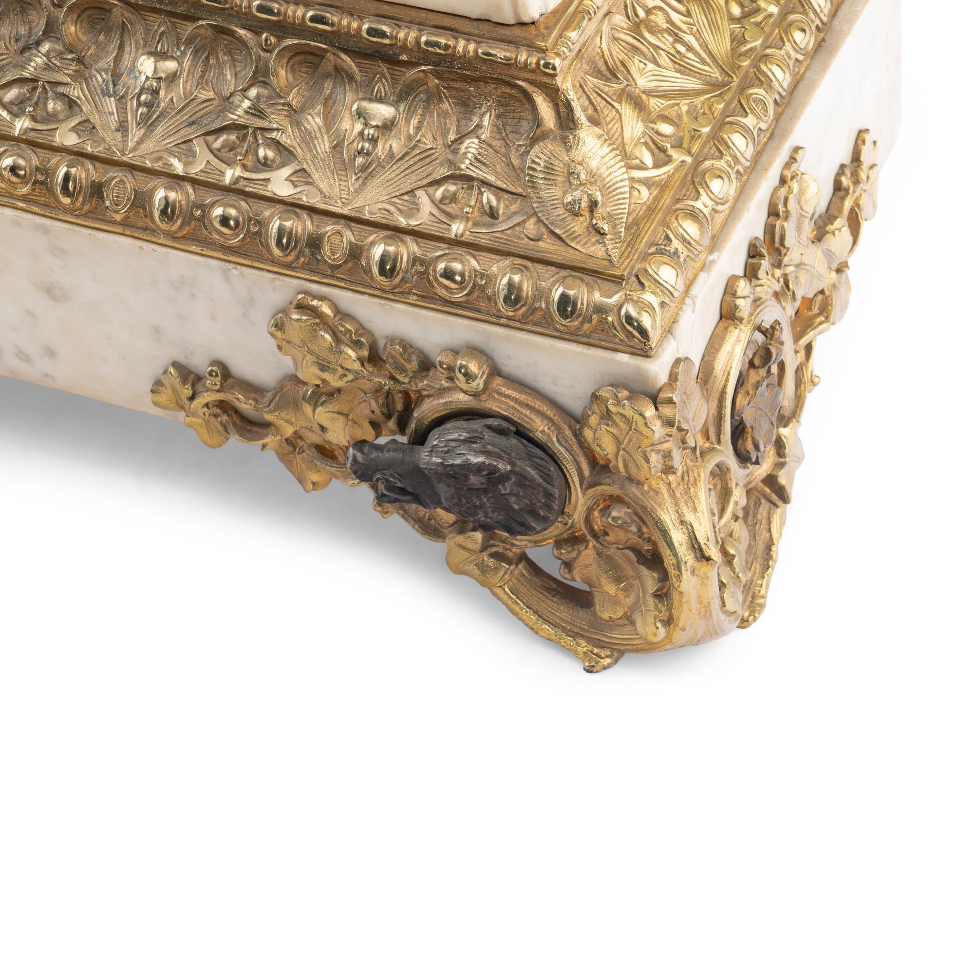 A French Parcel-Gilt Bronze Mounted Marble Mantel Clock