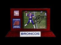 A Peyton Manning Signed Photograph and Game Used Football Fragment (Fanatics Authentic),