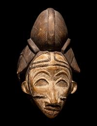 Four Punu Wood Masks