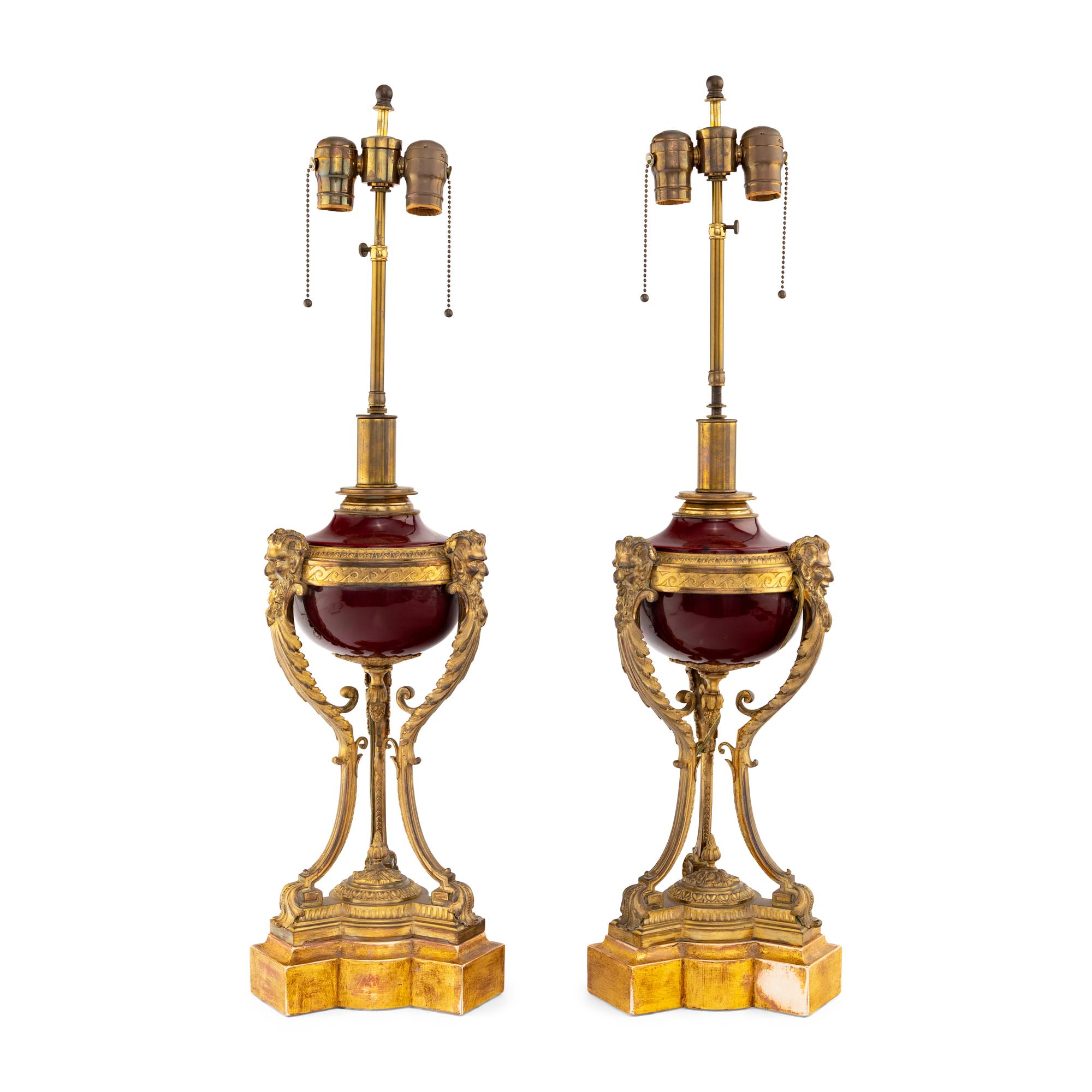 A Pair of Louis XVI Style Gilt Bronze Mounted Porcelain Urns