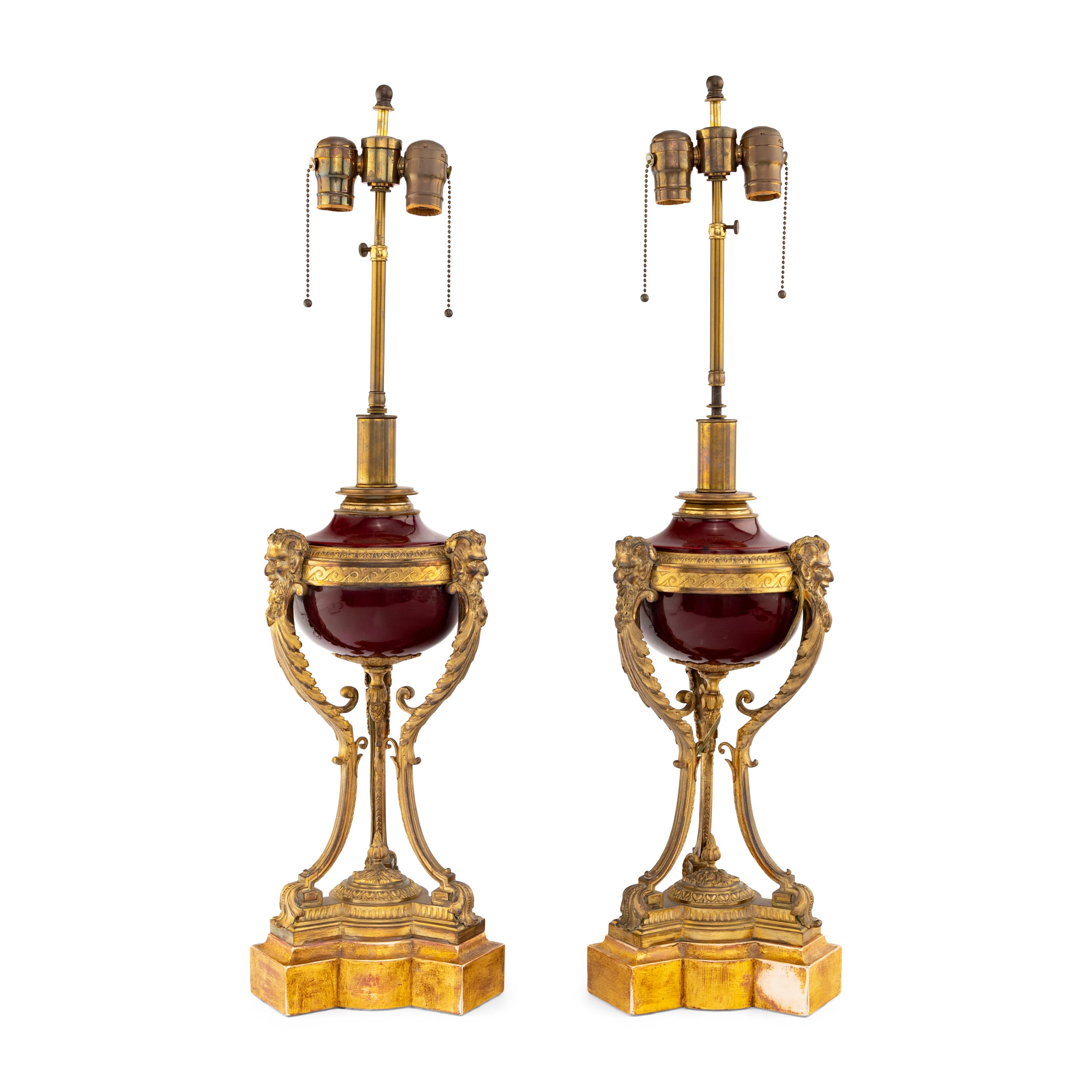 A Pair of Louis XVI Style Gilt Bronze Mounted Porcelain Urns