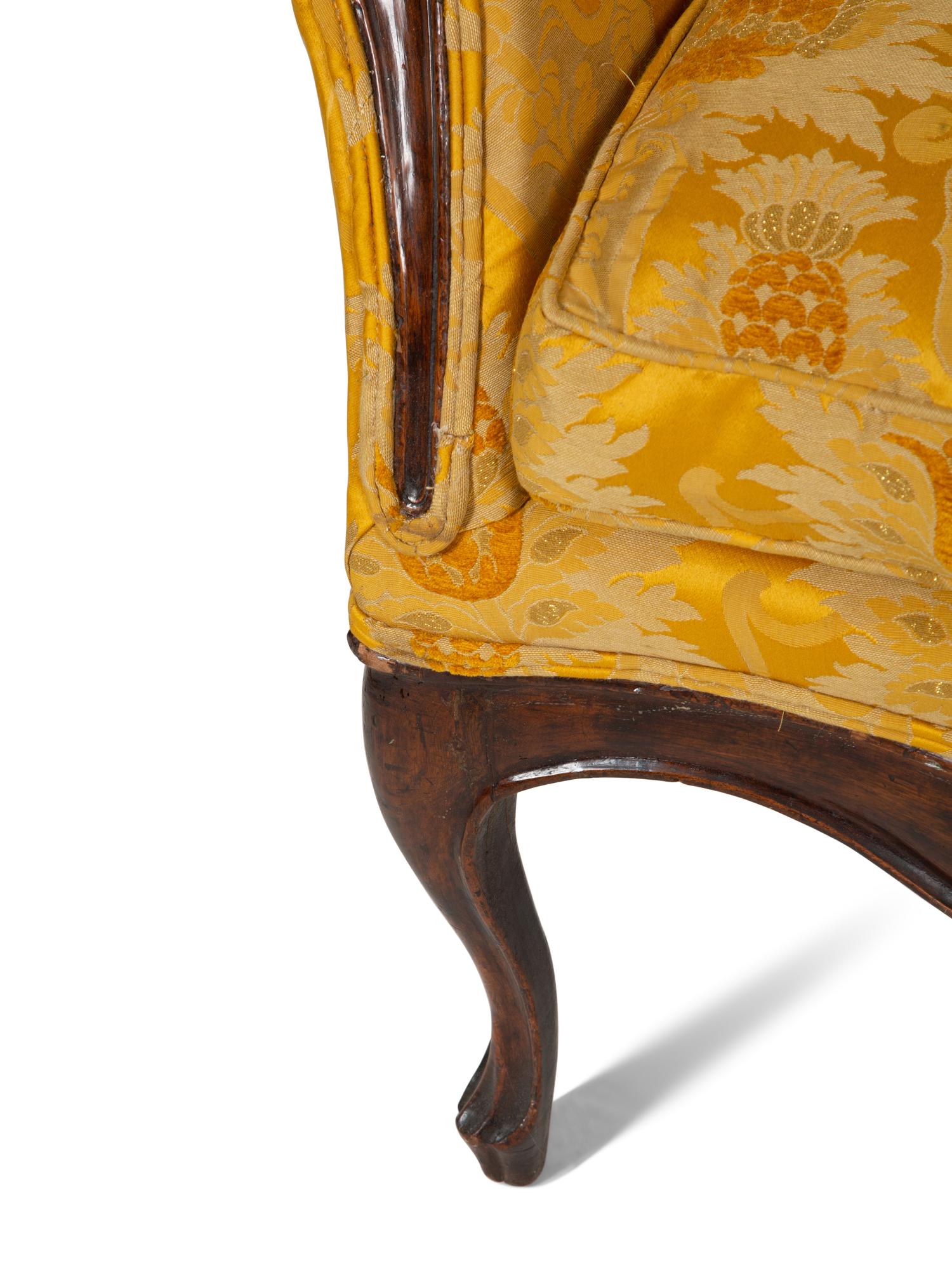 A Louis XV Provincial Carved Walnut Settee