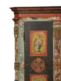 A Continental Carved, Painted and Parcel Gilt Pine Schrank