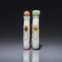 Two Chinese Yangzhou School Glass Overlay Snuff Bottles, Second Half 19th Century 清晚期 涅白地套五色料鼻烟壺兩支