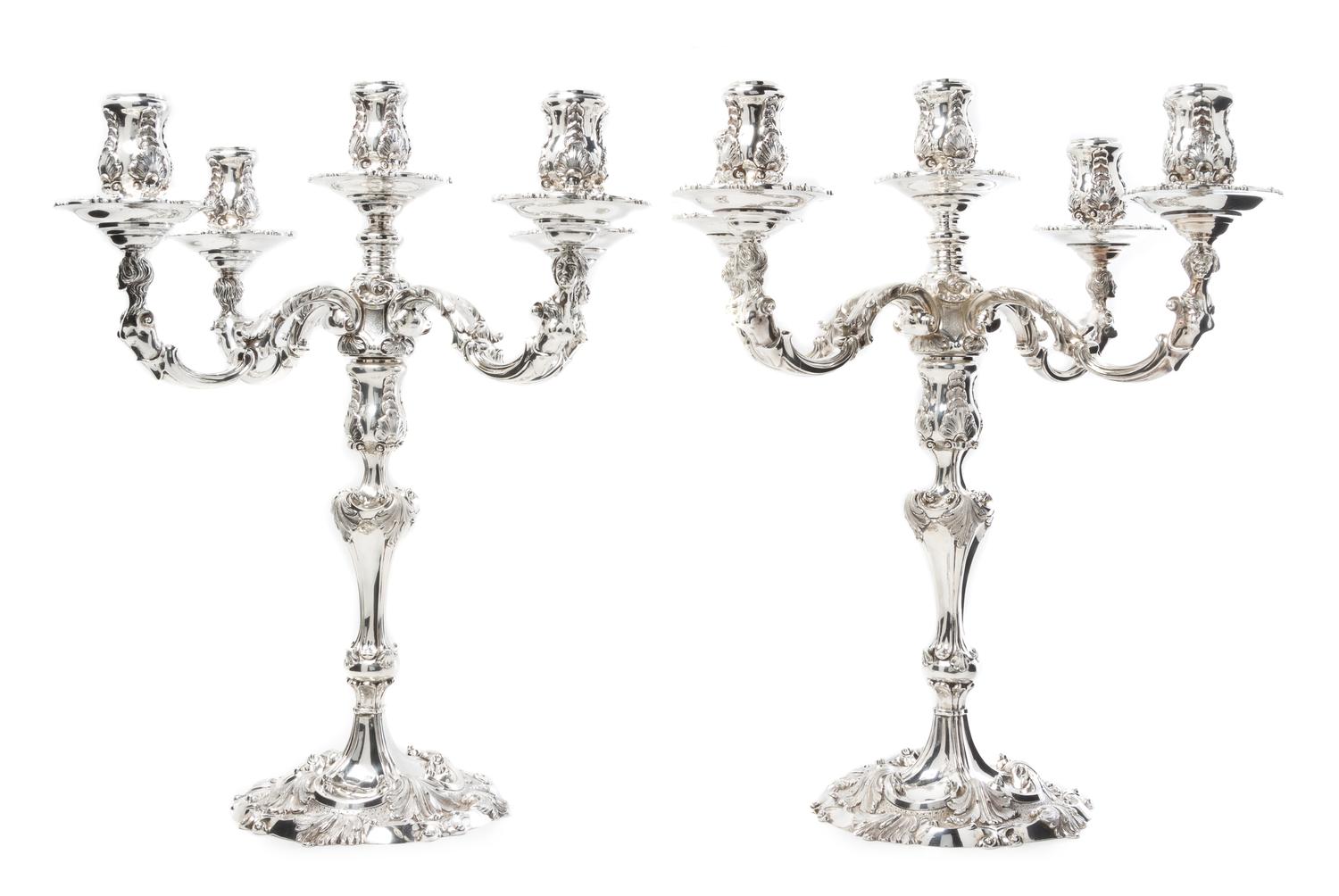 A Pair of Elizabeth II Silver Five-Light Candelabra, Garrard & Co. Ltd., London, 1969, the candle cups of baluster form with rocaille d
