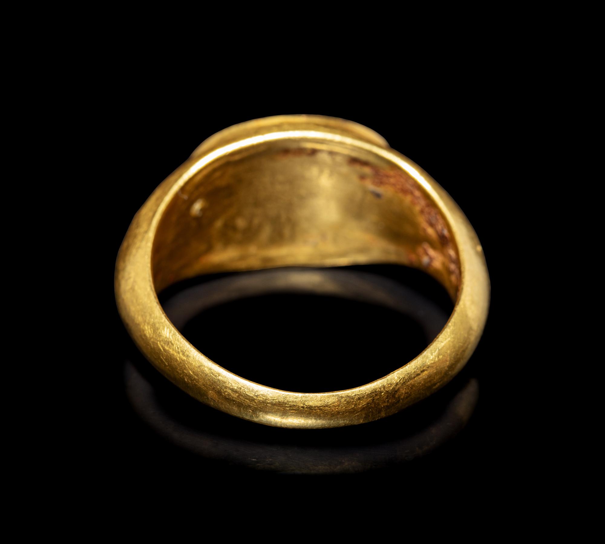 A Roman Gold and Garnet Finger Ring with the Goddesses Athena and Nike