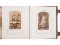 [EARLY PHOTO] CDV album incl. image of Lincoln's elk-horn chair, with photo of Buffalo Bill's boots