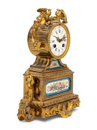 A French Gilt Metal and Porcelain Clock