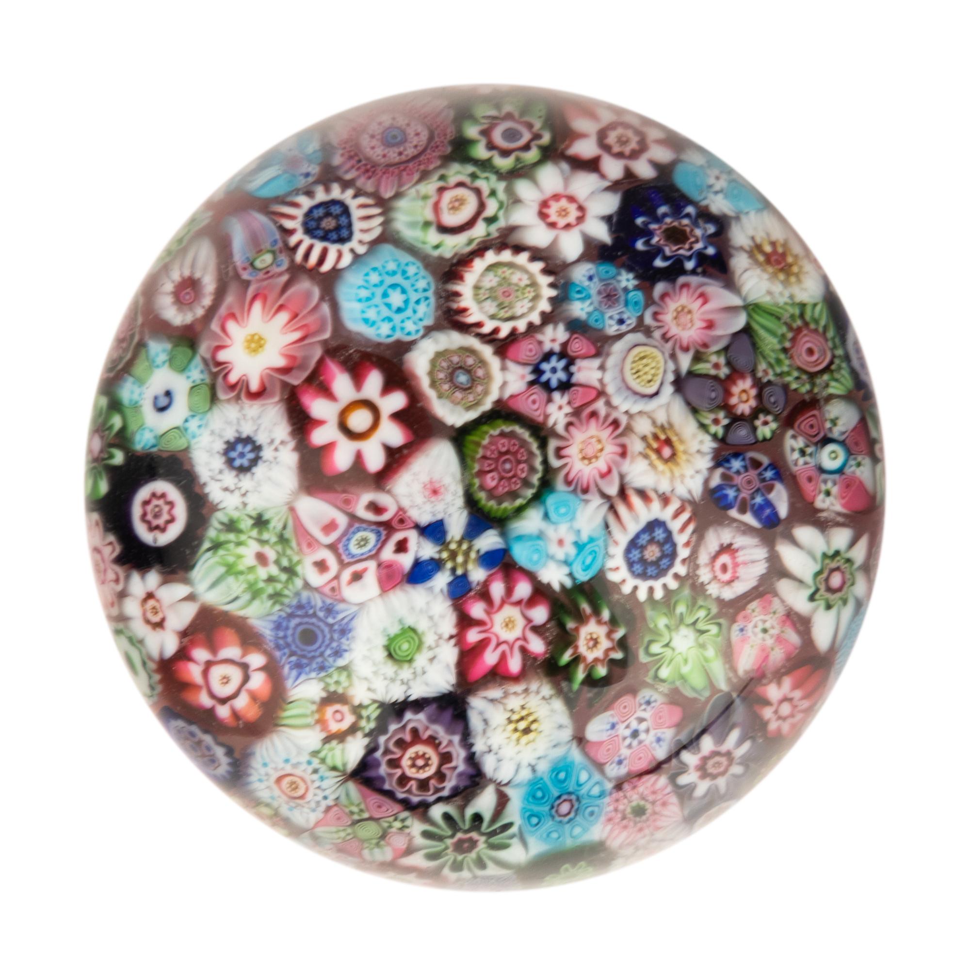 A Miniature Clichy Close Packed Millefiori Glass Paperweight