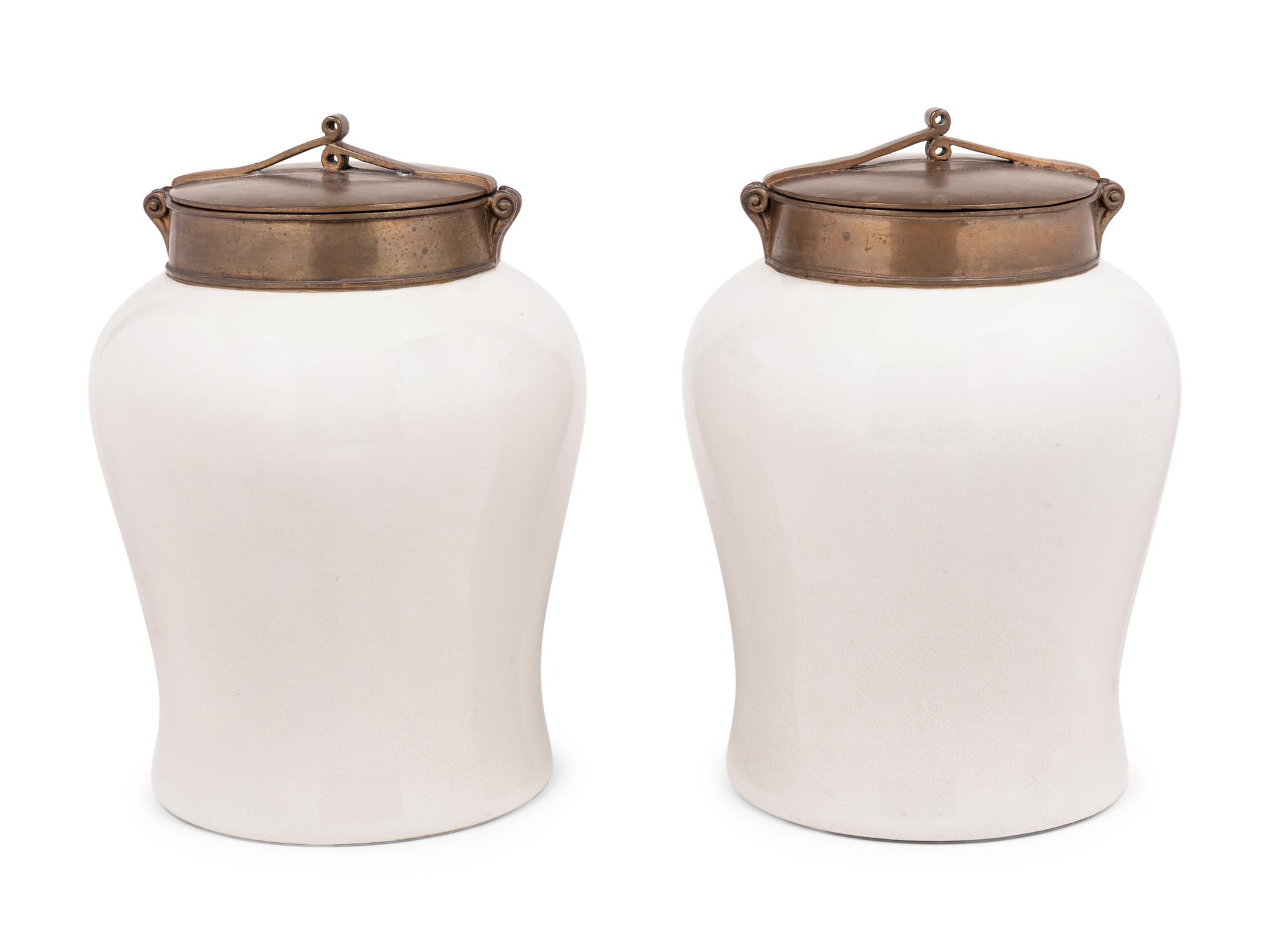 A Pair of Brass Mounted White Glazed Porcelain Jars