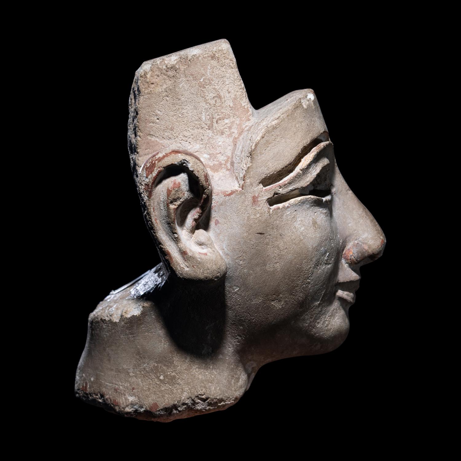 An Egyptian Limestone Head from a Composite Statue