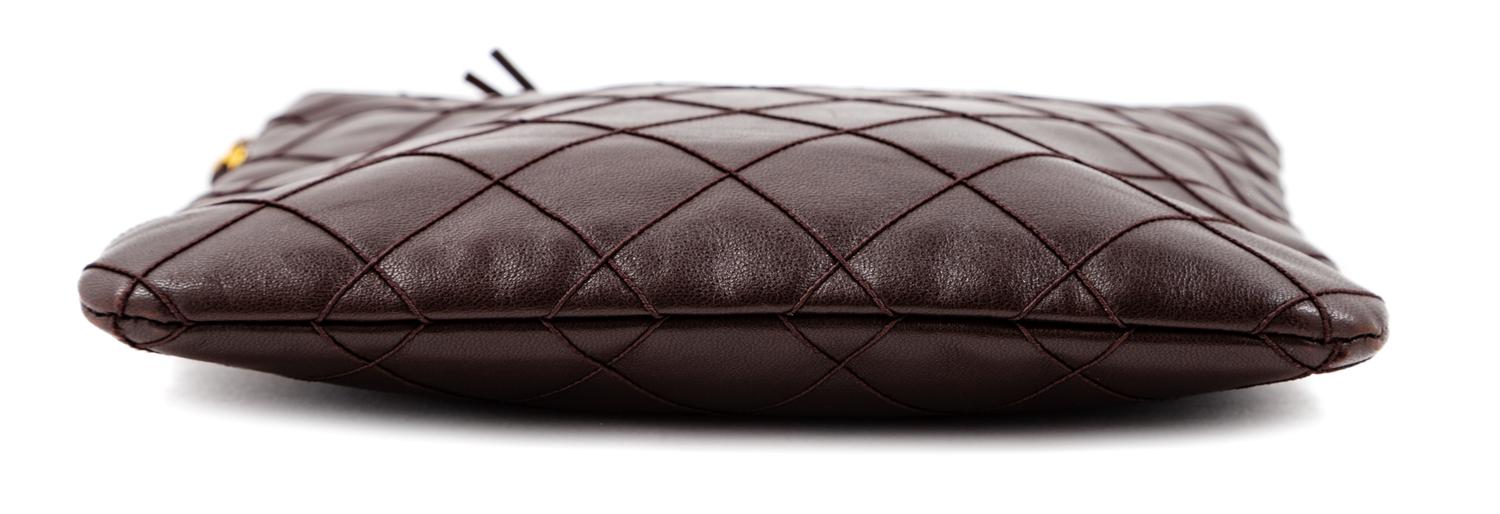 A Chanel Dark Brown Quilted Cross Body Bag, 7.5" H x 8.25" W; Strap drop: 19".