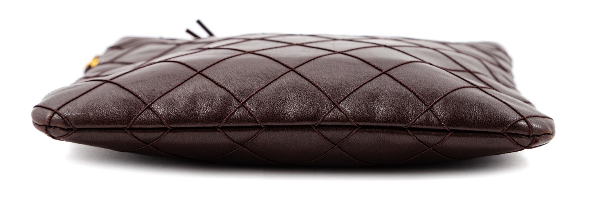 A Chanel Dark Brown Quilted Cross Body Bag, 7.5" H x 8.25" W; Strap drop: 19".