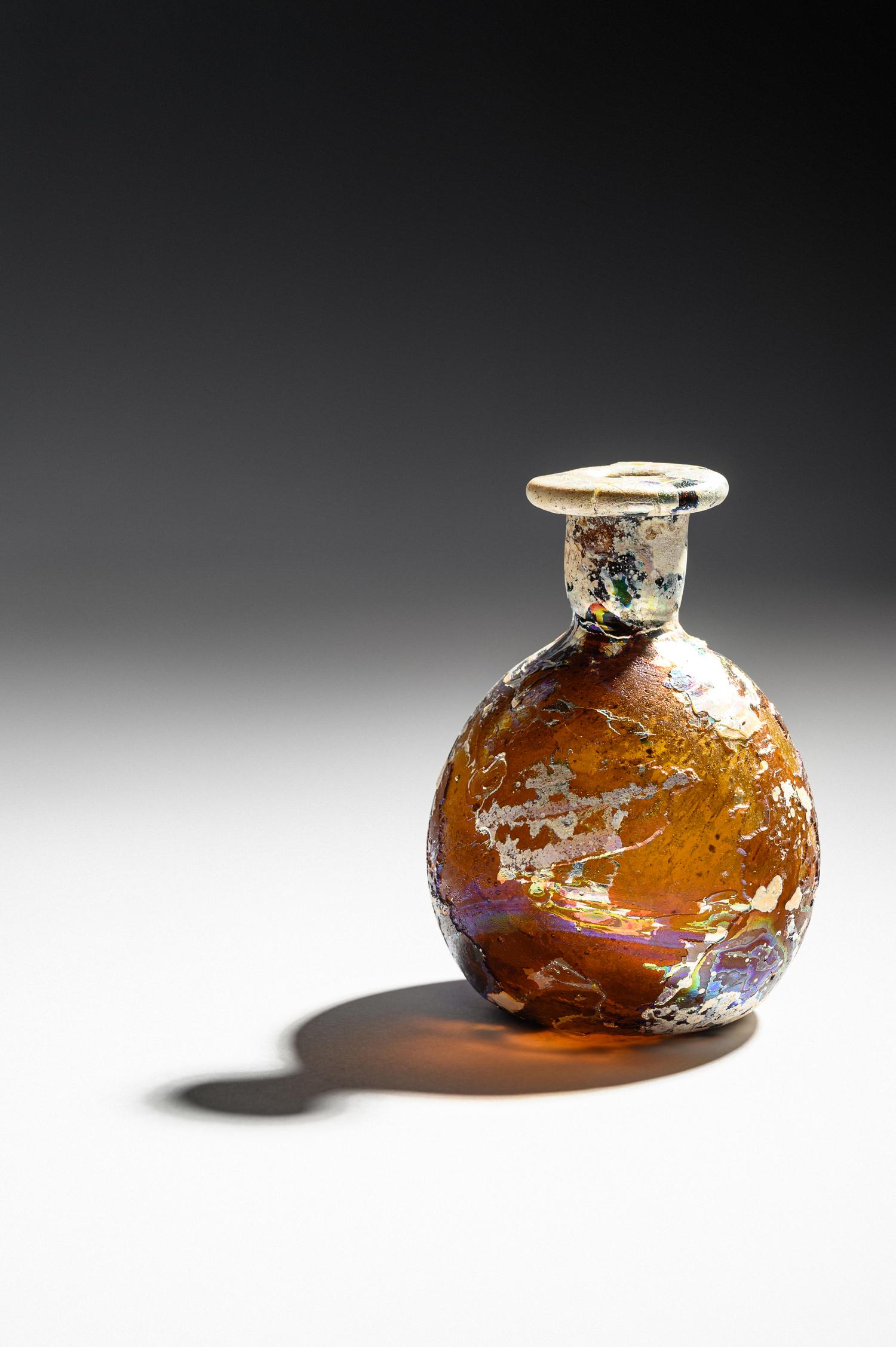 A Roman Amber Glass Flask