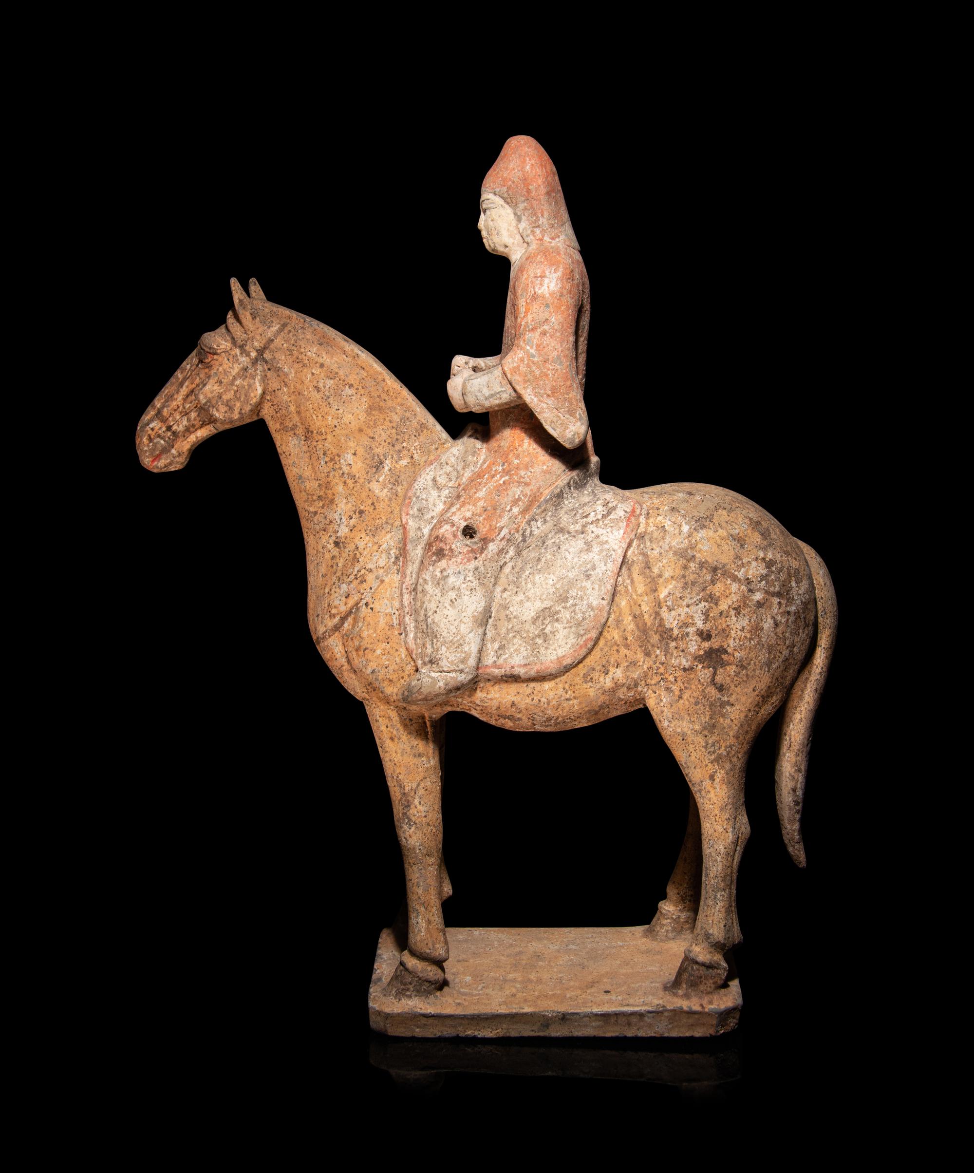 A Pair of Painted Pottery Equestrian Figures