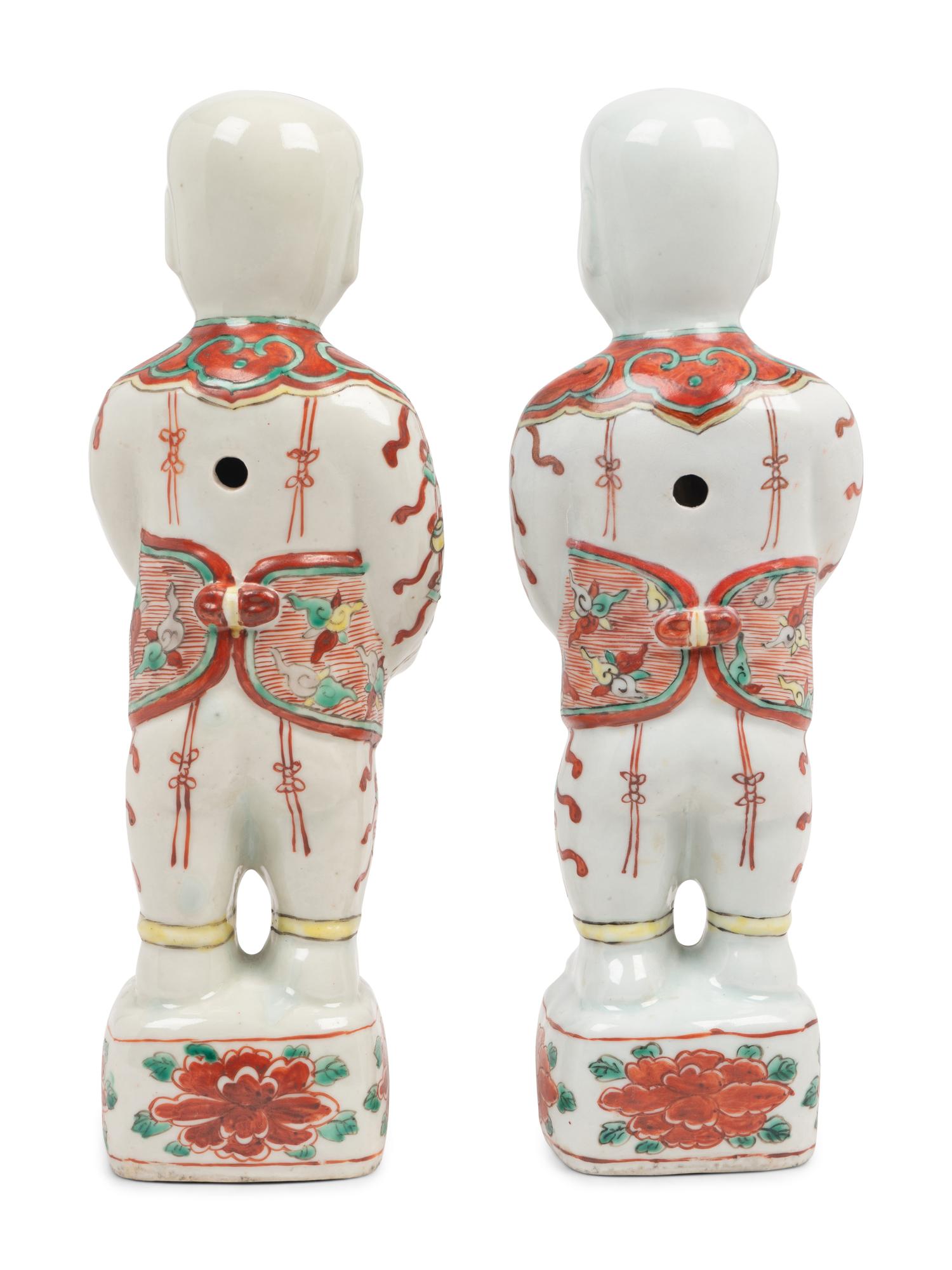 A Pair of Chinese Export Porcelain Models of Standing Boys