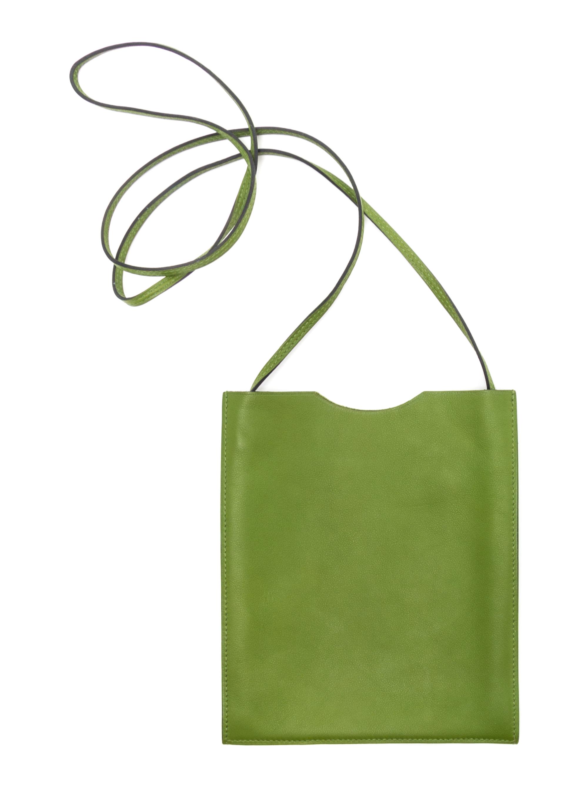 An Hermes Vert Anis Leather Passport Pouch, 7" x 8" x 1".