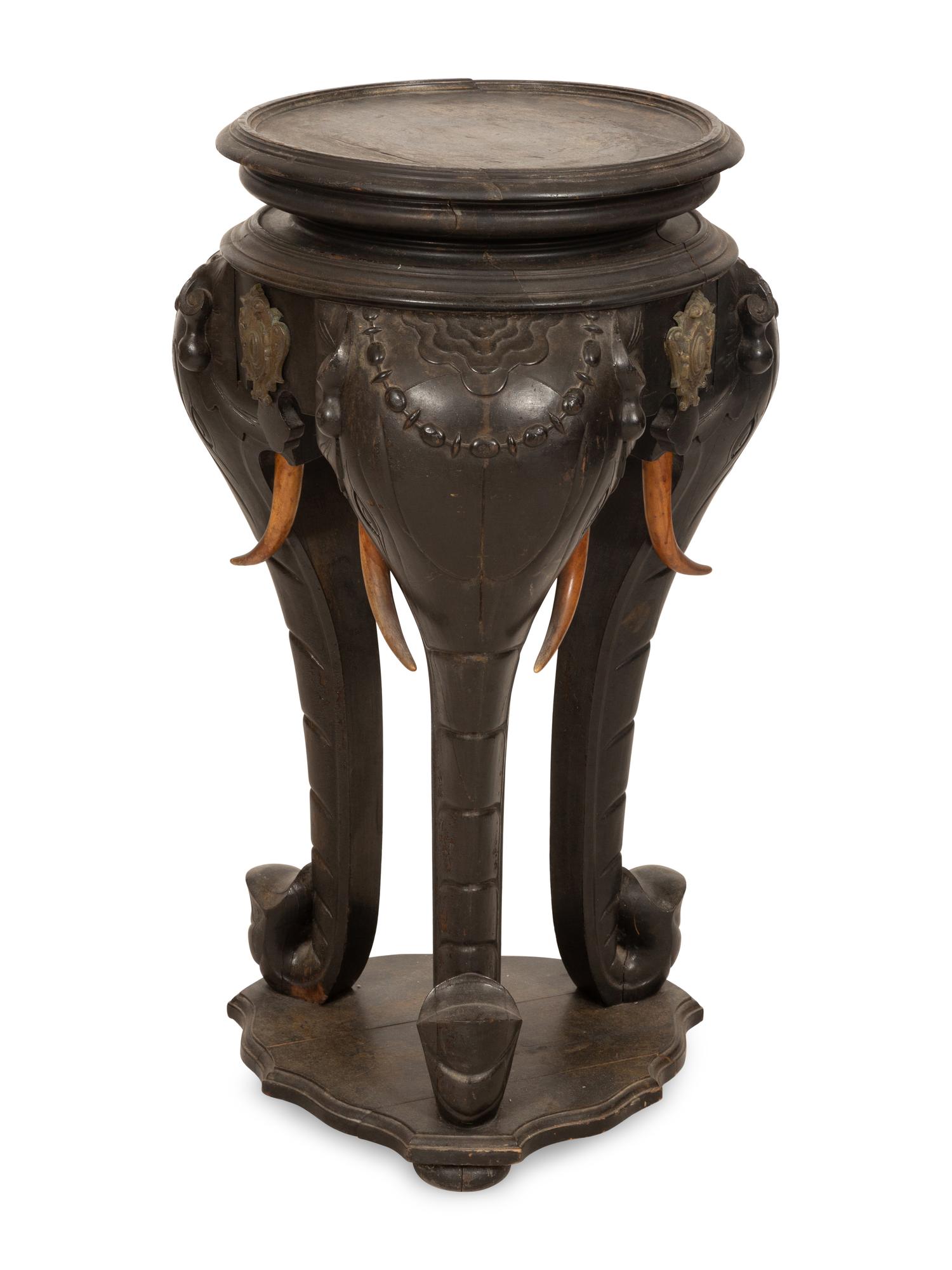 An Anglo-Indian Carved Ebonized Elephant Table