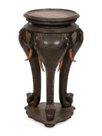 An Anglo-Indian Carved Ebonized Elephant Table