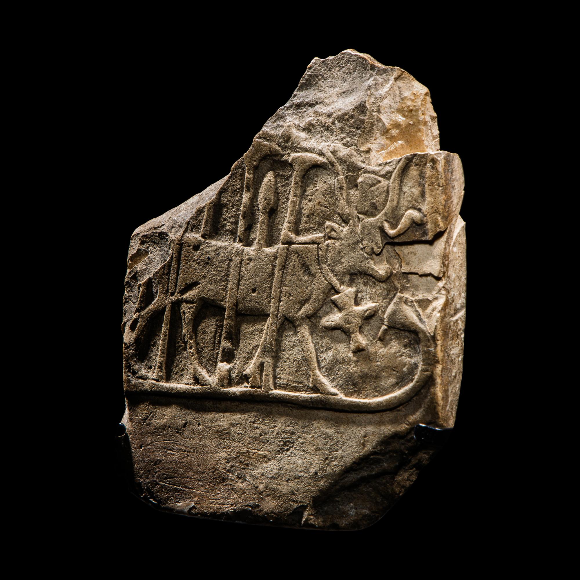 An Egyptian Limestone Stele Fragment with Hathor
