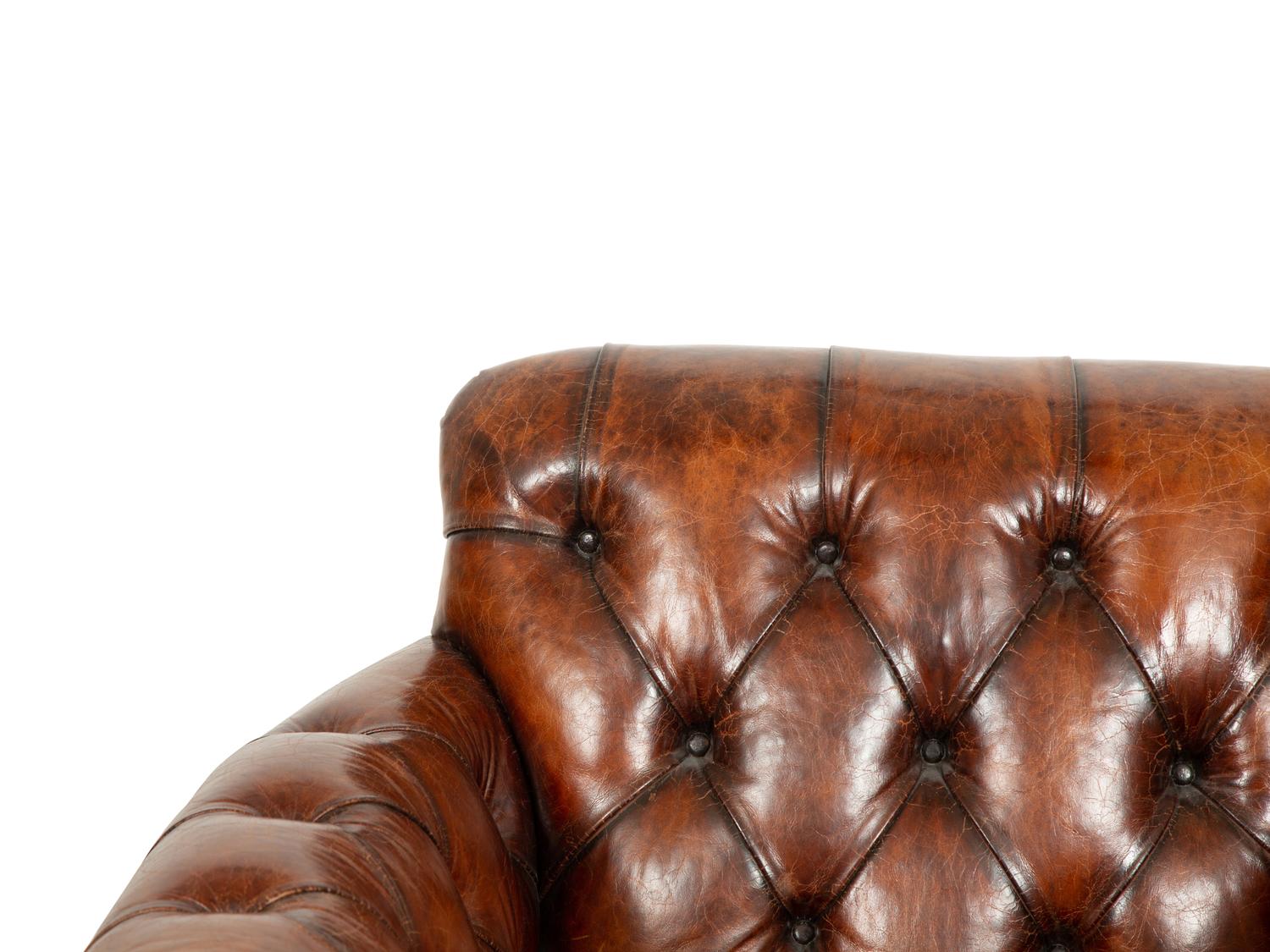 A Pair of Chesterfield Style Leather Club Chairs