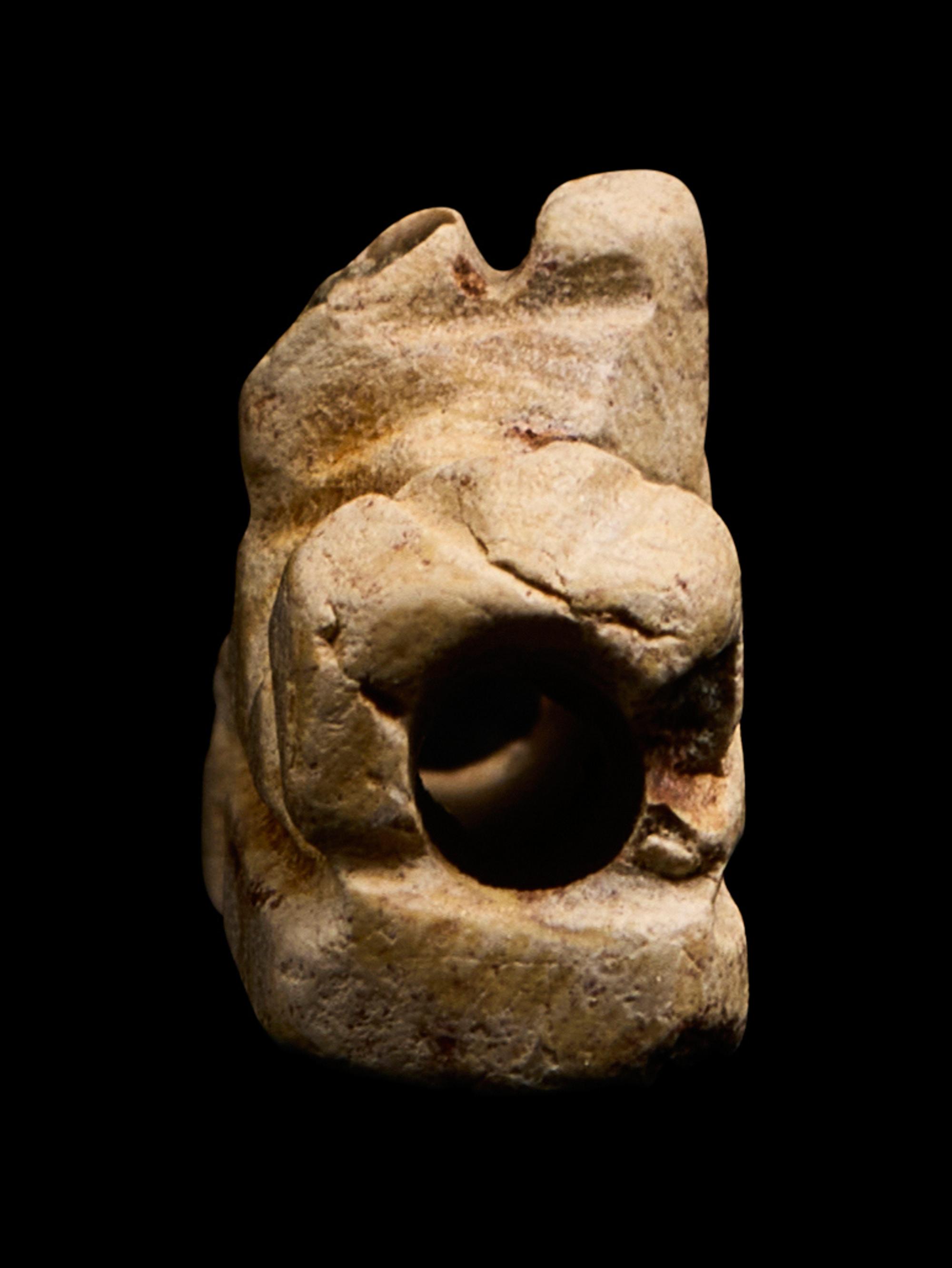 An Egyptian Faience Recumbent Bull or Ram