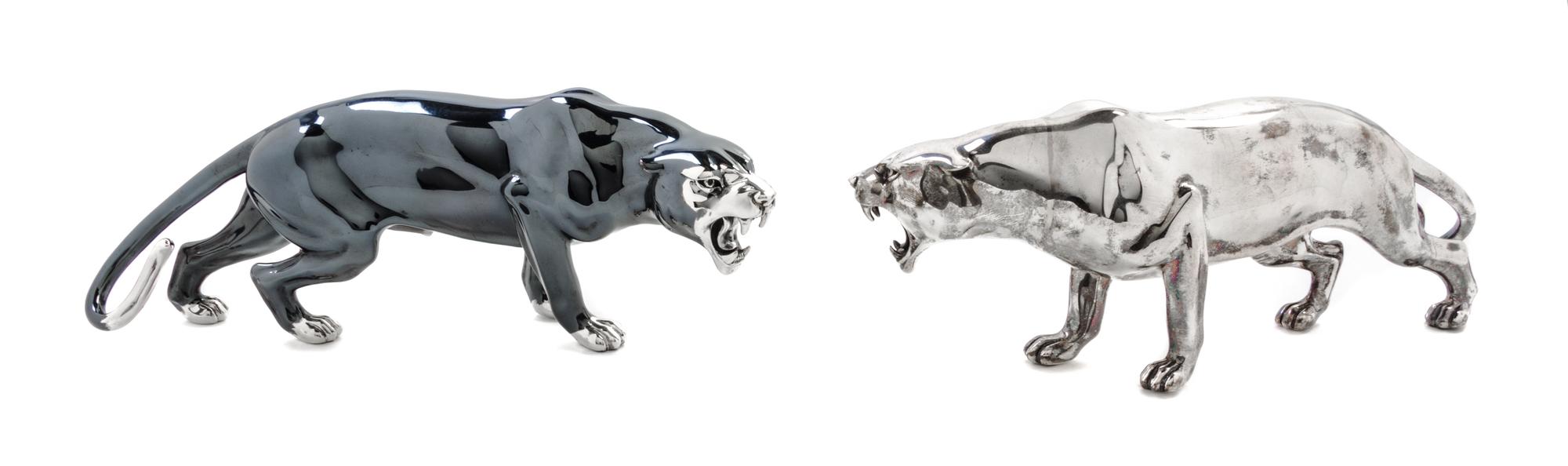 A Pair of Italian Silver Table Ornaments, 20th Century, each in the form of a striding panther.